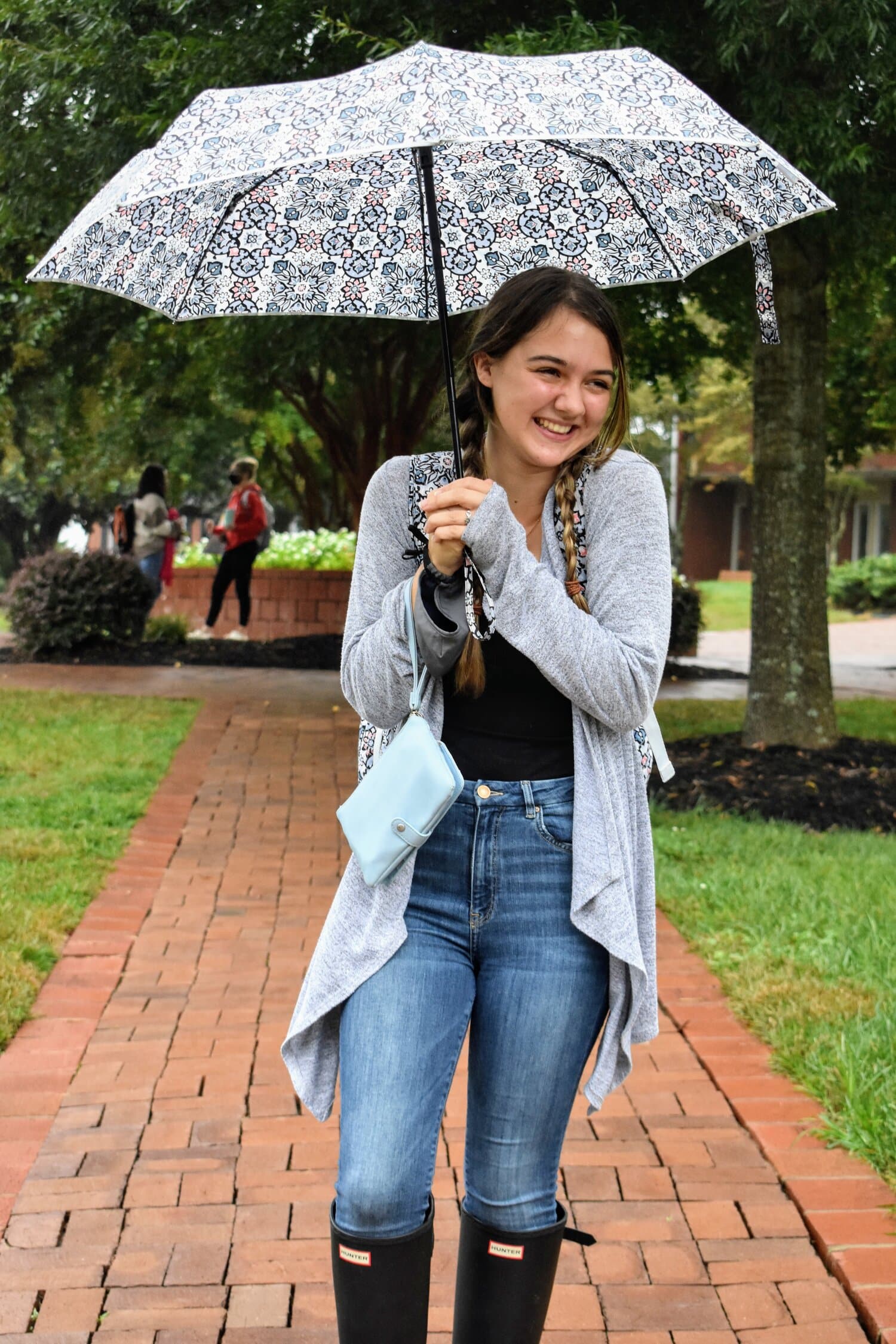 With lots of rain in our area, Rylee Merrill, elementary education major, is taking a stroll with her umbrella through campus. 