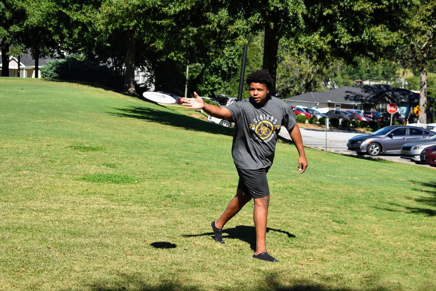 Devonaire Willouhhby, sophomore, throws a frisbee on the stud field.