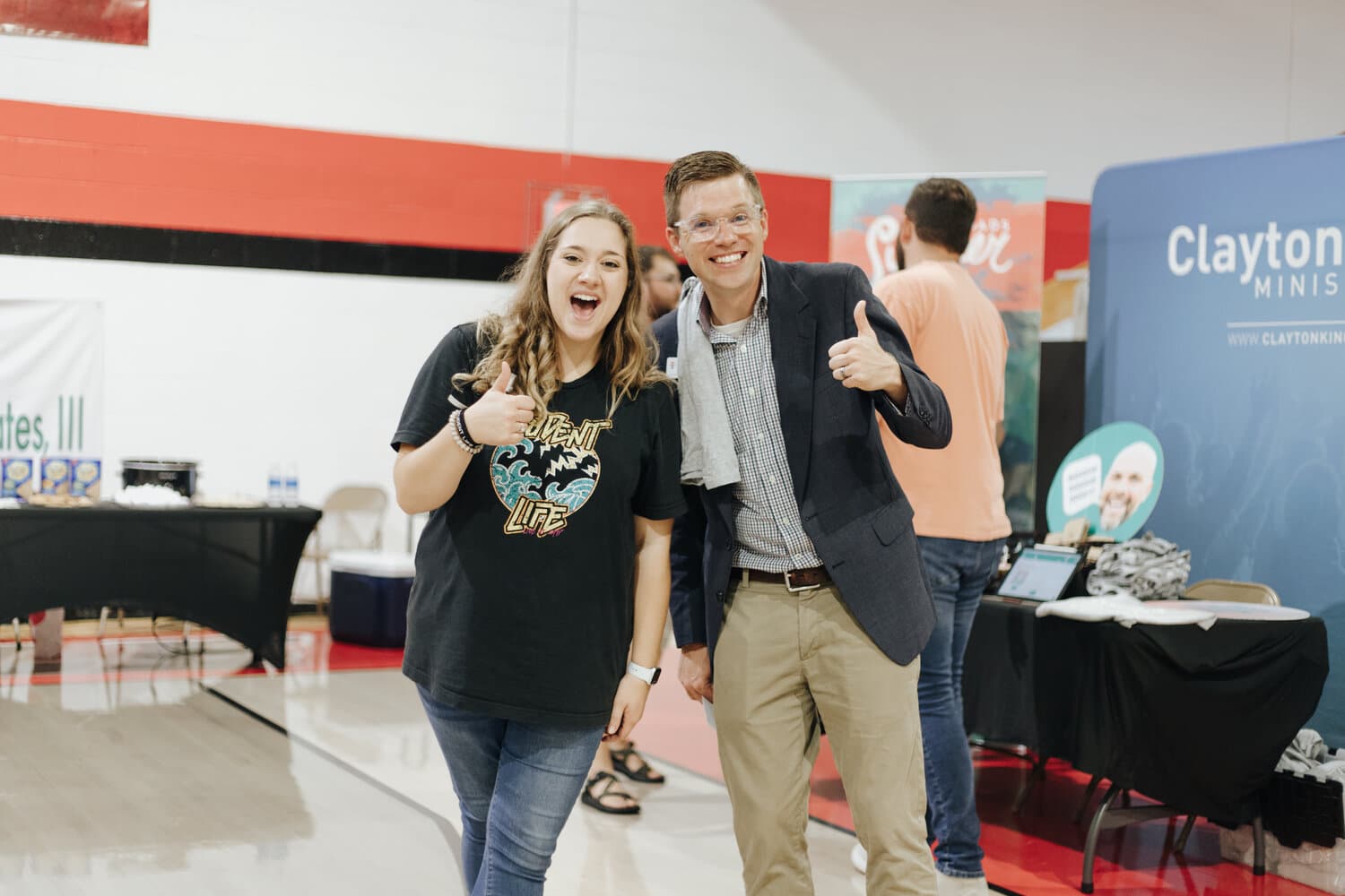 Familiar NGU faces, including grad assistant Nicole Pollard and outreach staff member Joshua Gilmore, give a thumbs up for the students who are finding summer plans through this event.