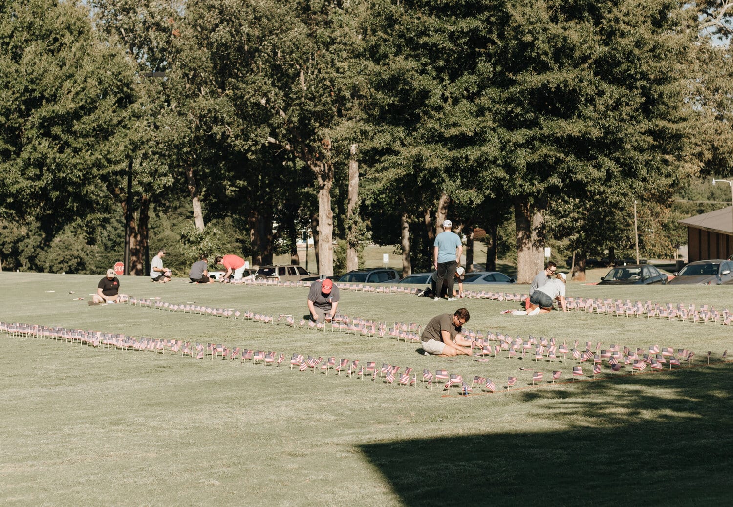 Even in the heat, the members of Young Americans for Freedom steadily worked at putting out flags.