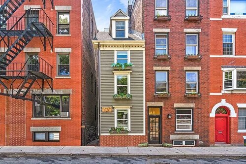 44 Hull Street, Boston — Also known by locals as a ‘‘Spite house’.’ This small green home will soon become the residence to a family of four. Photo courtesy of Zillow.com.