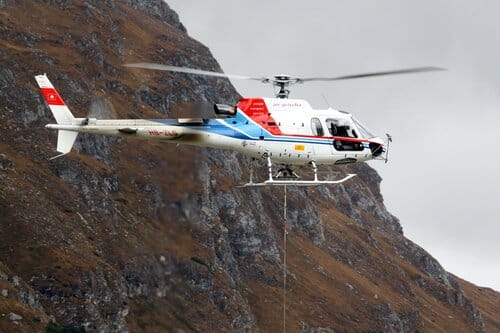 Using a tether system just like this, injured cows were airlifted from higher pastures to other transportation waiting below. Photo courtesy of Unsplash.com.