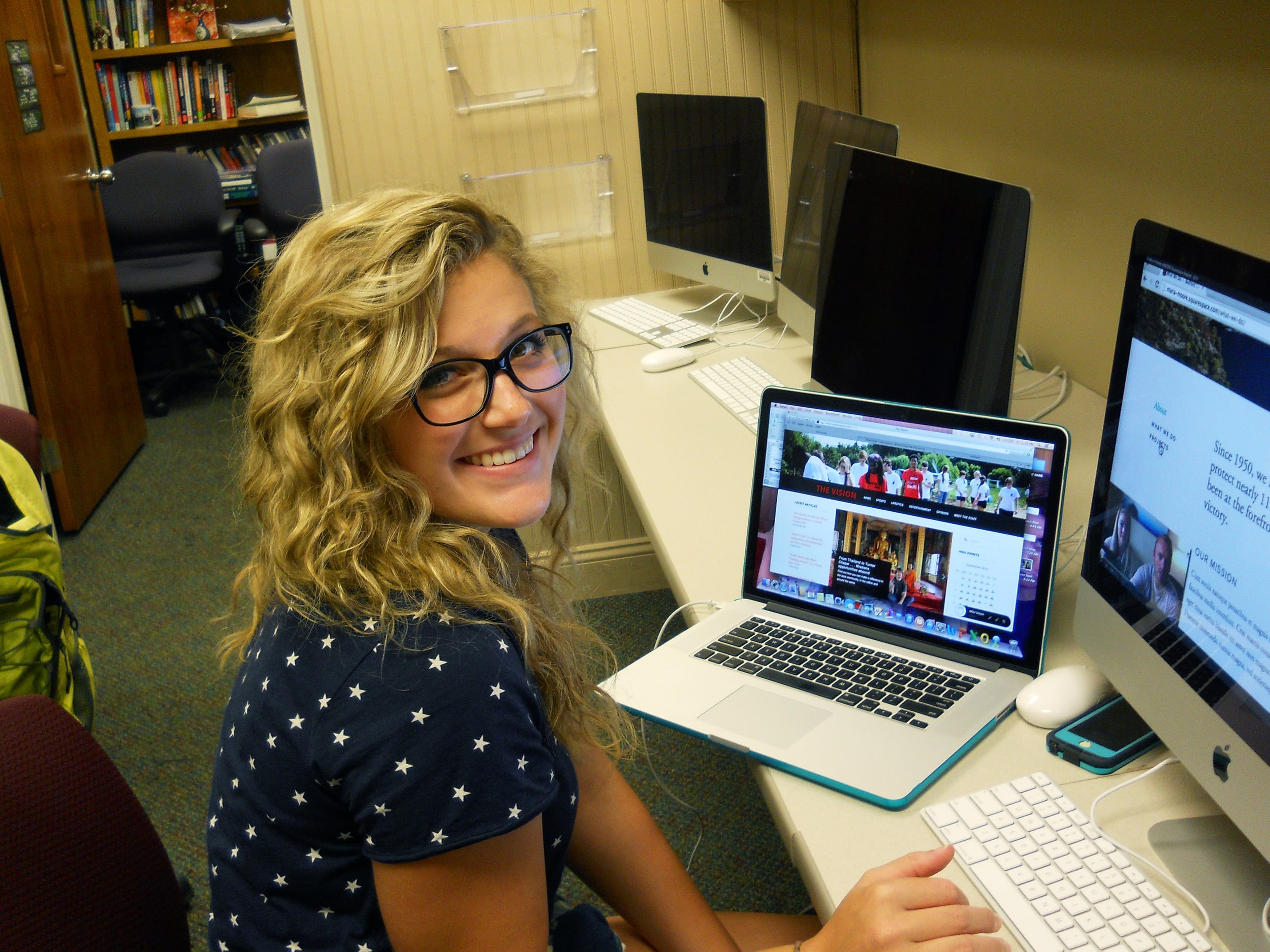 Carli Frady works on a story for "The Vision Magazine."