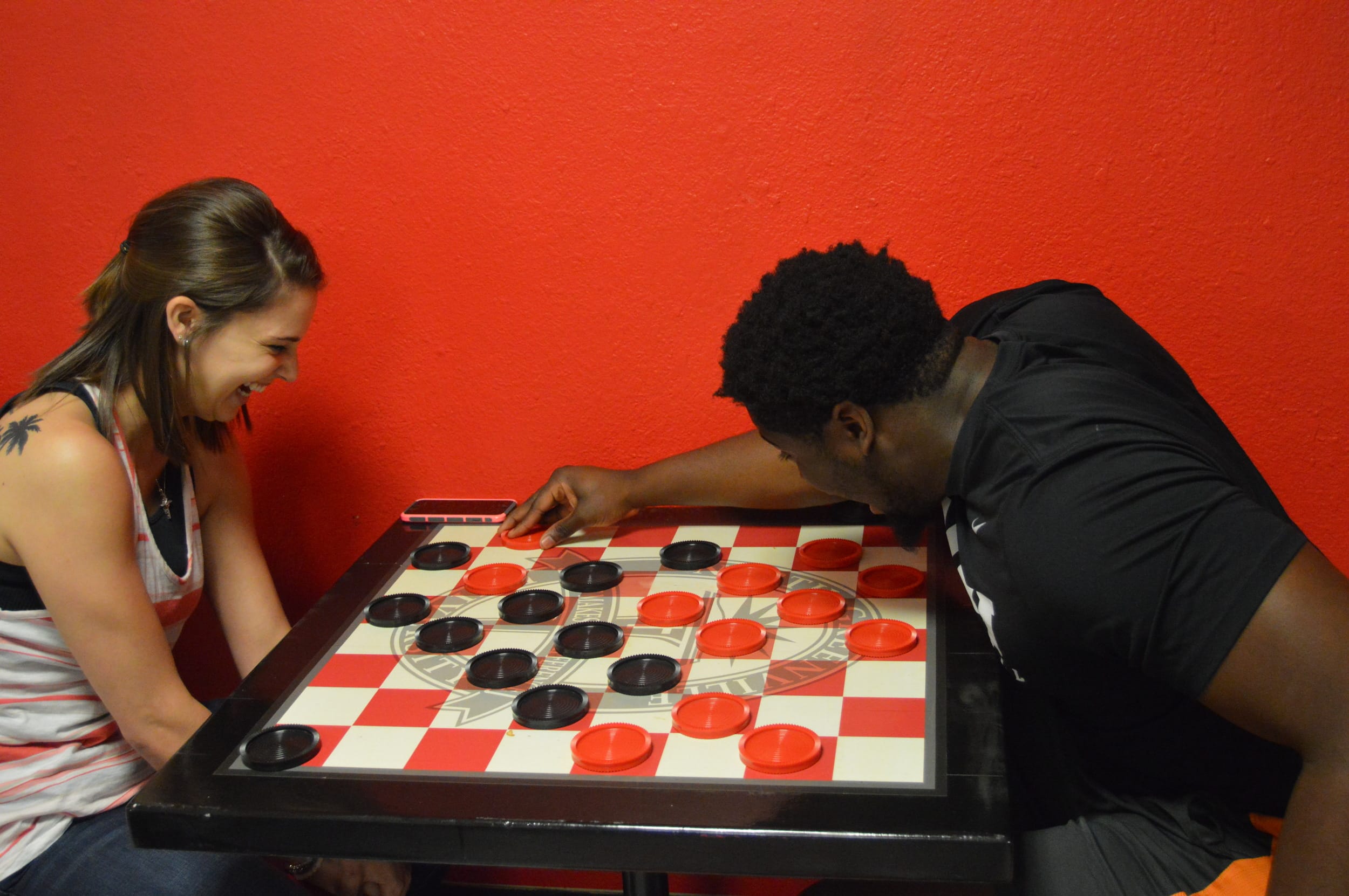 Tiffany Egan and Dominique Richardson engage in a lively chess match.