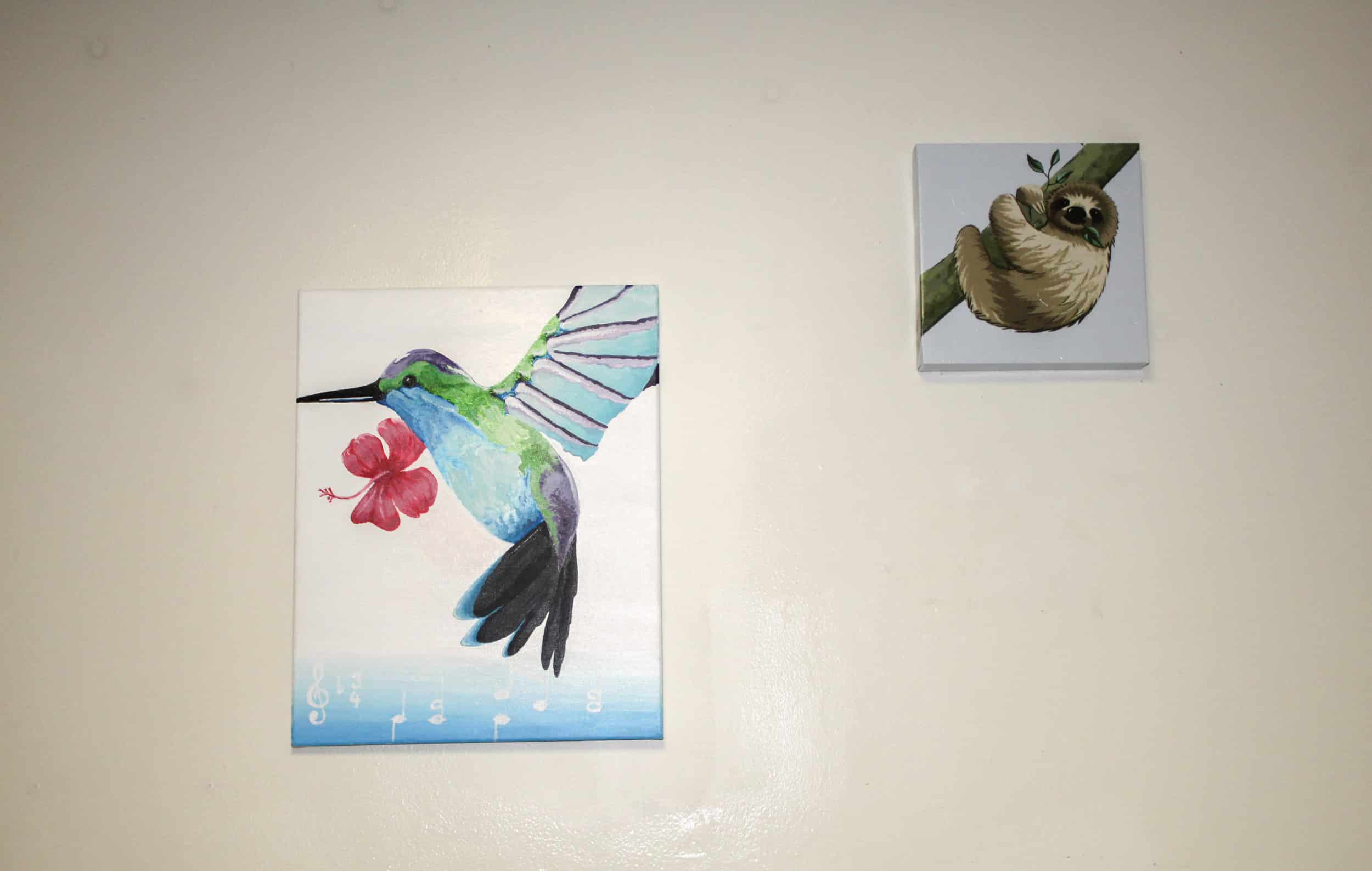 Gibson also displays pictures of different animals in her room. The painting of the sloth was painted by her friend.