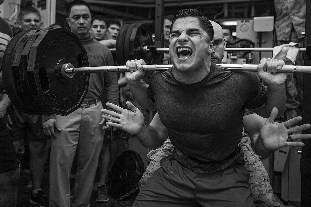 Jace Manning, Marine Medium Tiltrotor Squadron (VMM) 263 (Reinforced), 22nd Marine Expeditionary Unit (MEU), air traffic control staff noncommissioned officer in charge and native of Belton, Texas, squats 385 pounds during a weight-lifting competiti