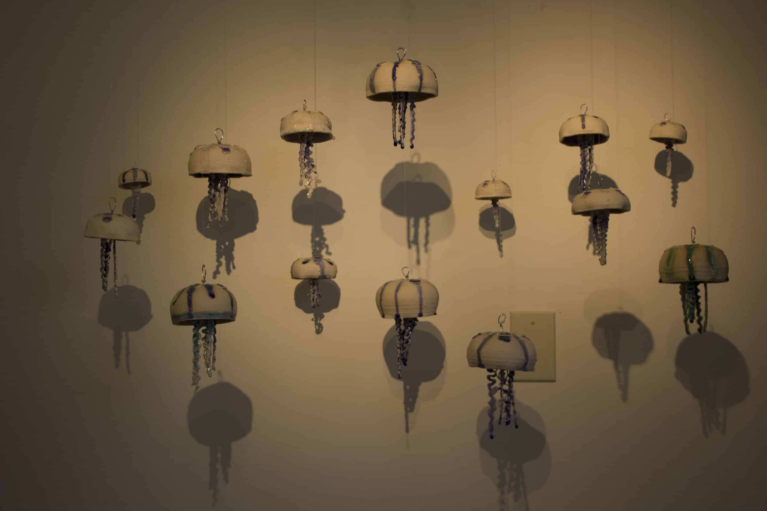Hayley Douglas' bloom of hanging ceramic jellyfish. Douglas is an instructor of graphic arts and ceramics at NGU.