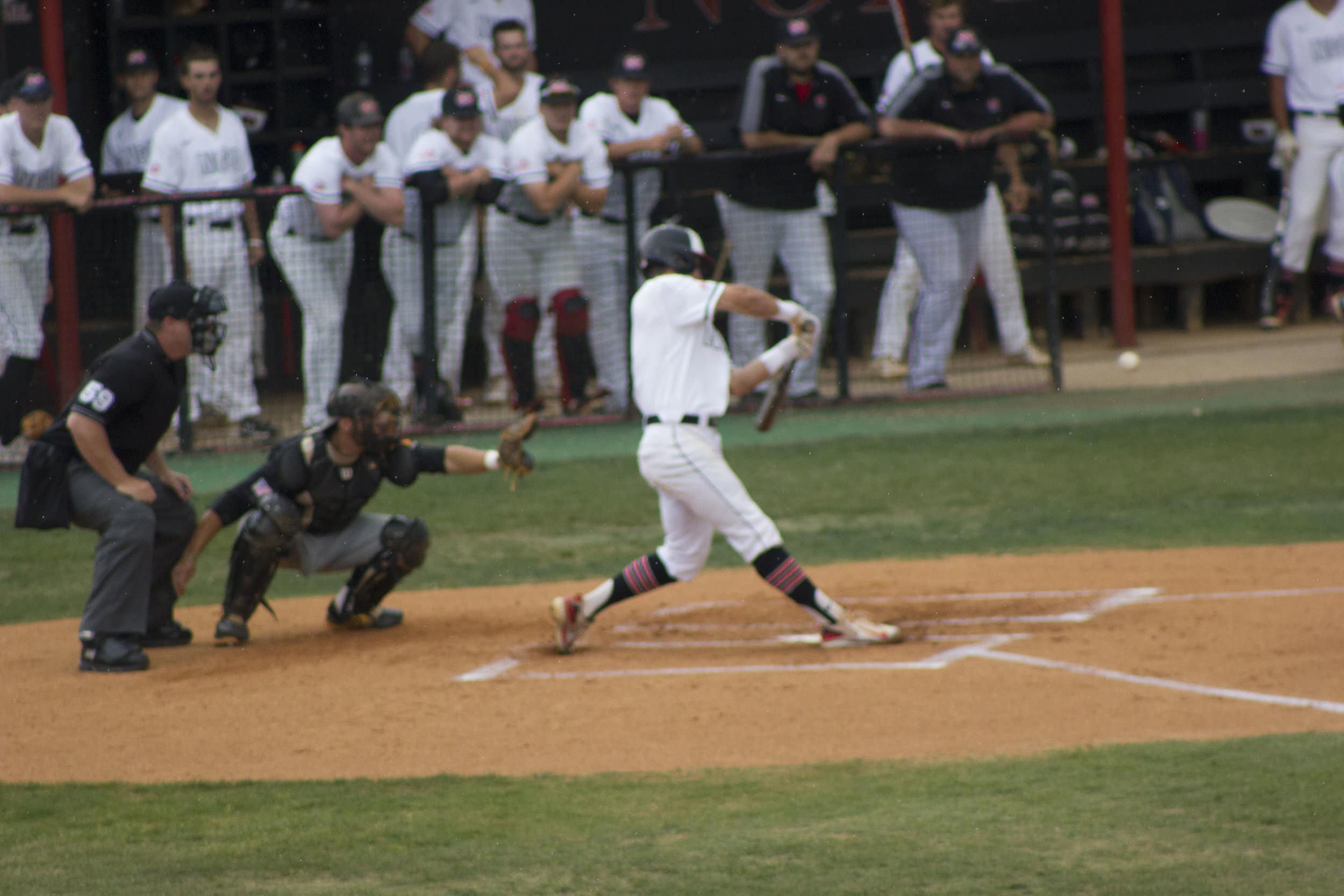 Ryan Brown, at bat, seeks to get on base with a base hit.