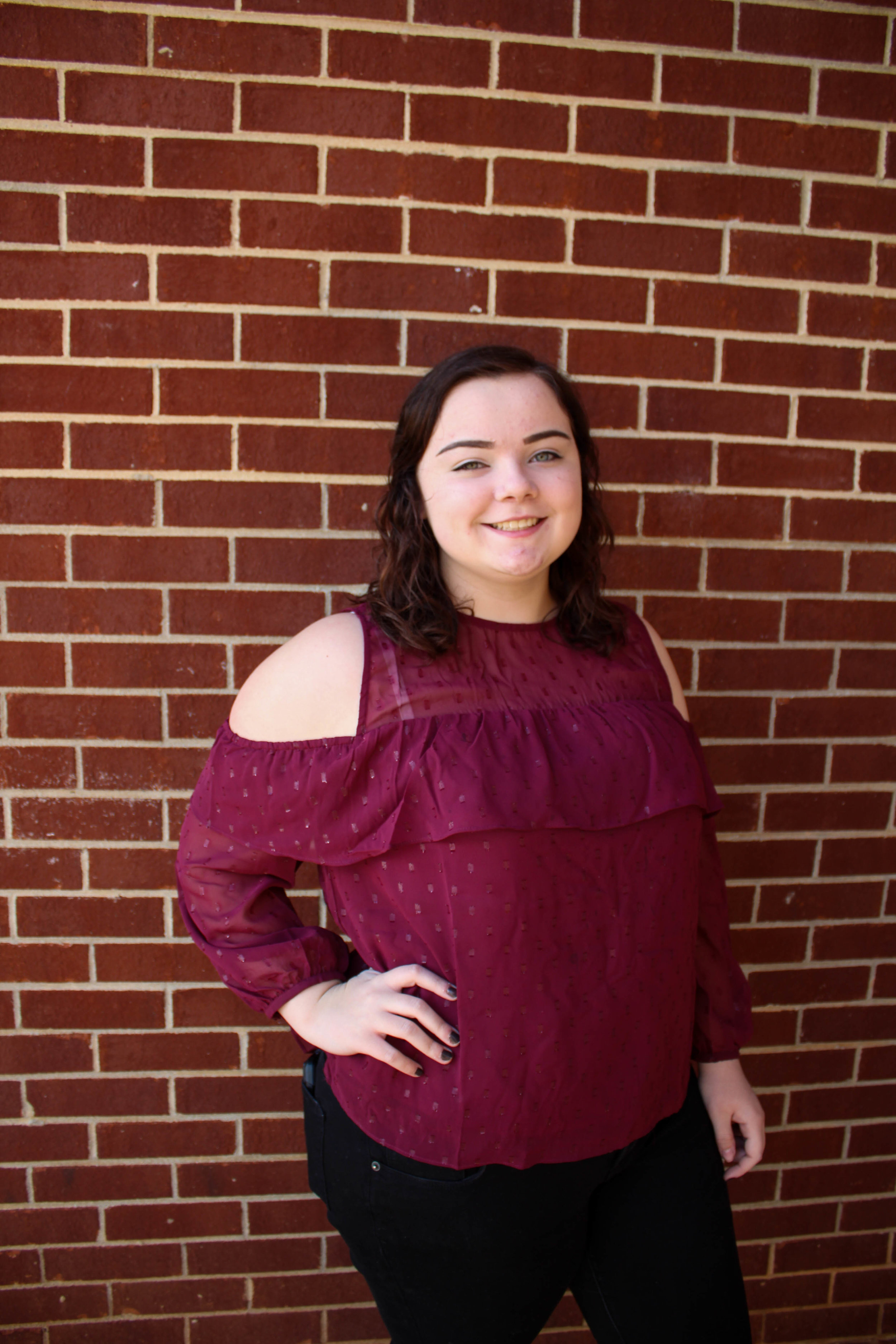 Freshman digital media major Taylor Deaton displays red outside of her dorm at North Greenville.