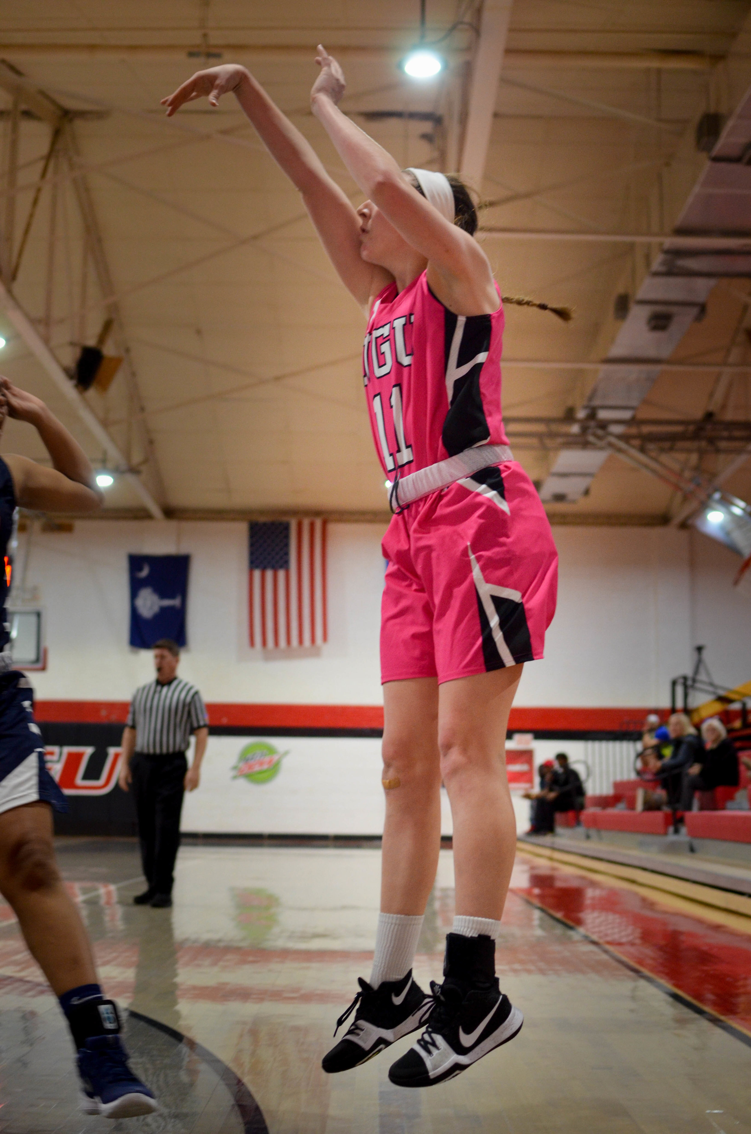 Kyli Schmitt shoots a long range jumper.