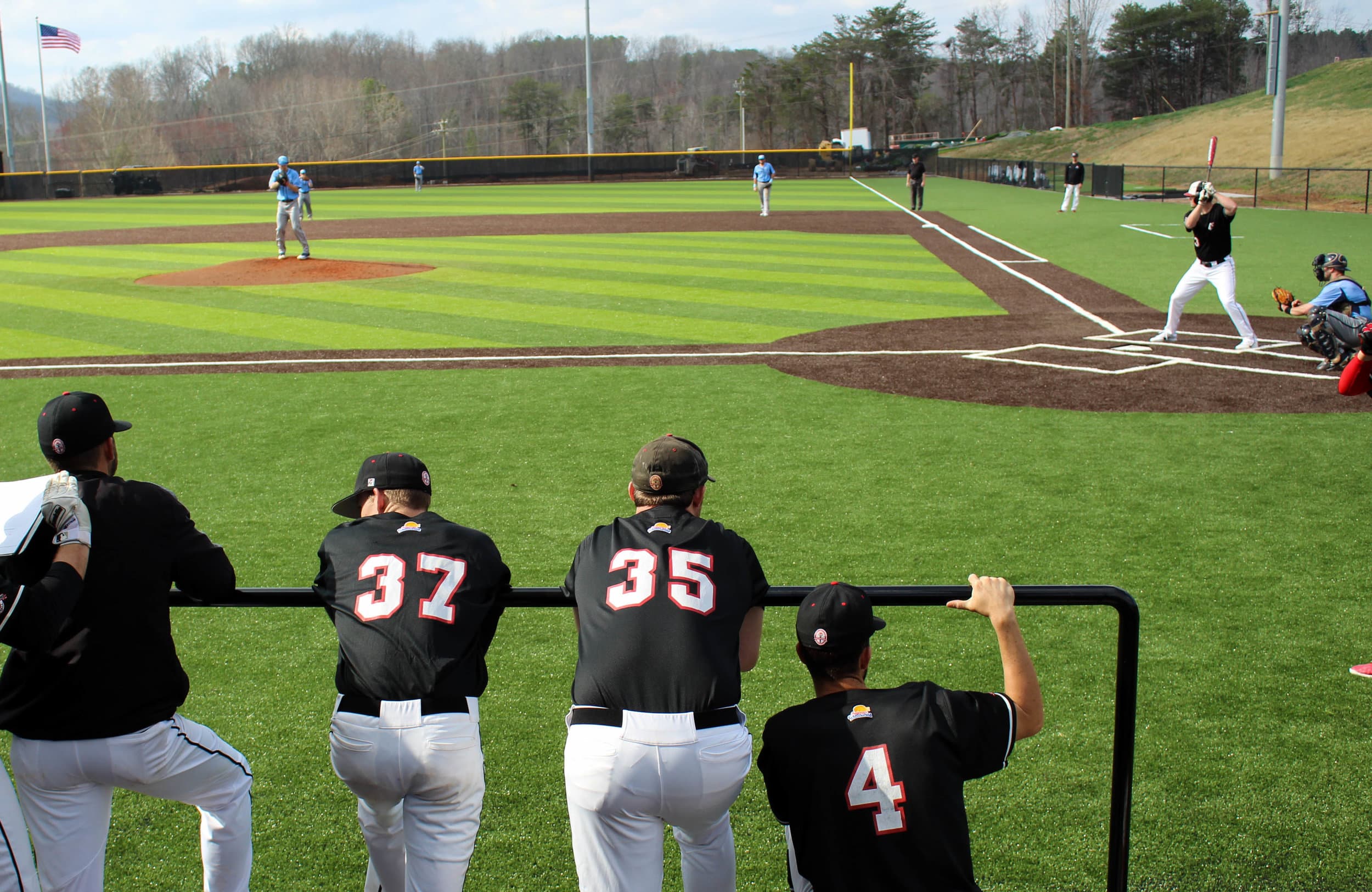 Ethan Struthers (37), Blake Hamilton (35)&nbsp;and Canaan Cropper (4) look on in support as Ryan Brown (3) is up to bat.