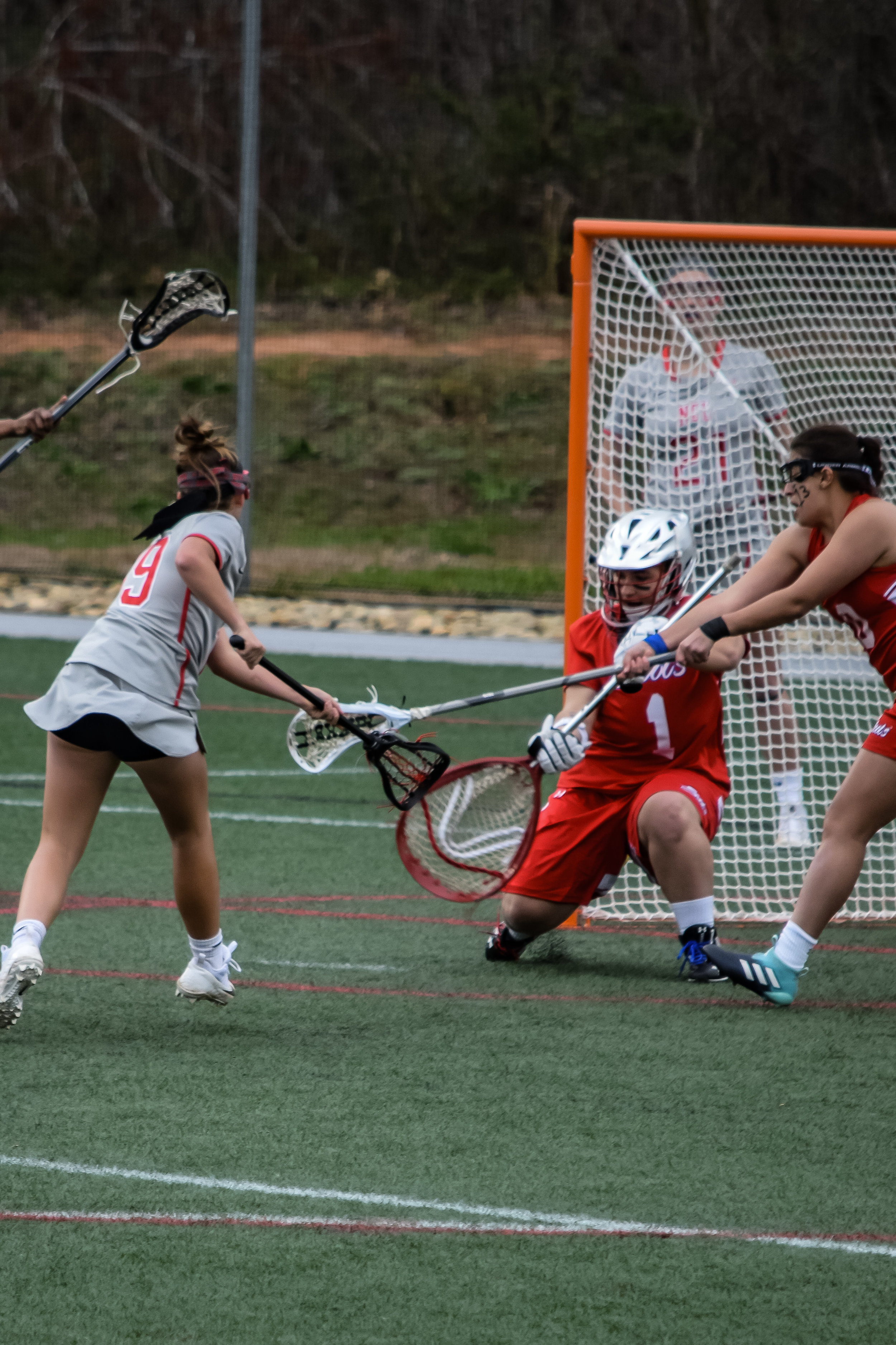 #19 Aly Estes launches the ball around the goalie's legs to score a goal for NGU.