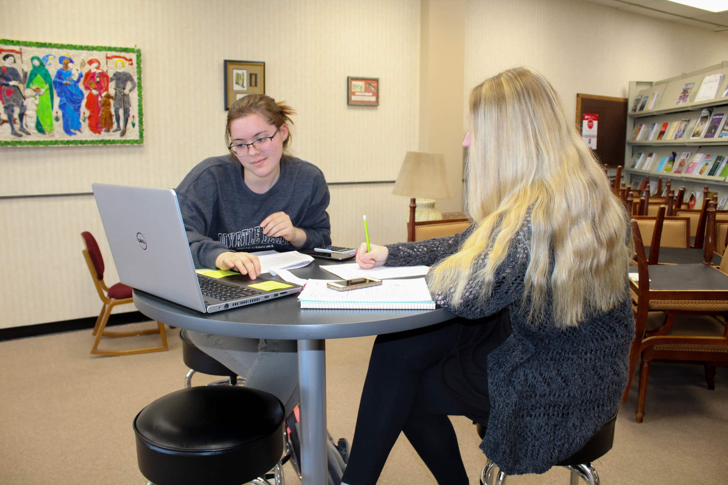 Fellow freshman biology majors Claire Smith and Katelin Hanna work on math work together.