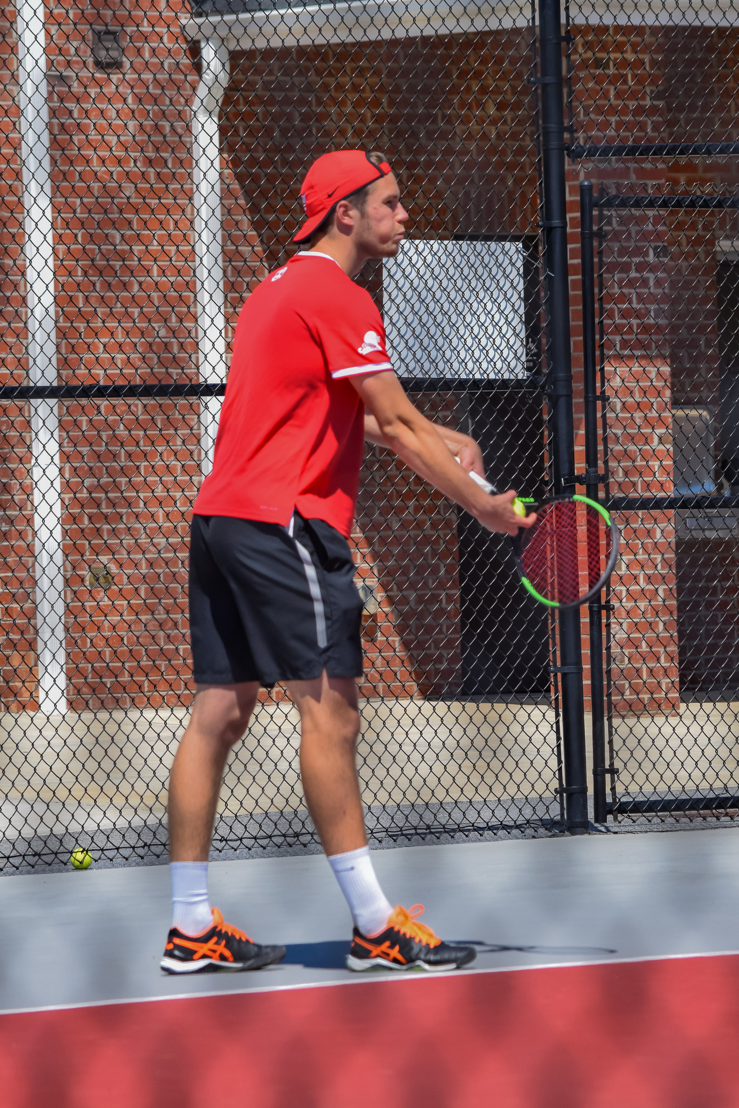 Senior Dion Nijboer gets ready to serve the first ball.&nbsp;