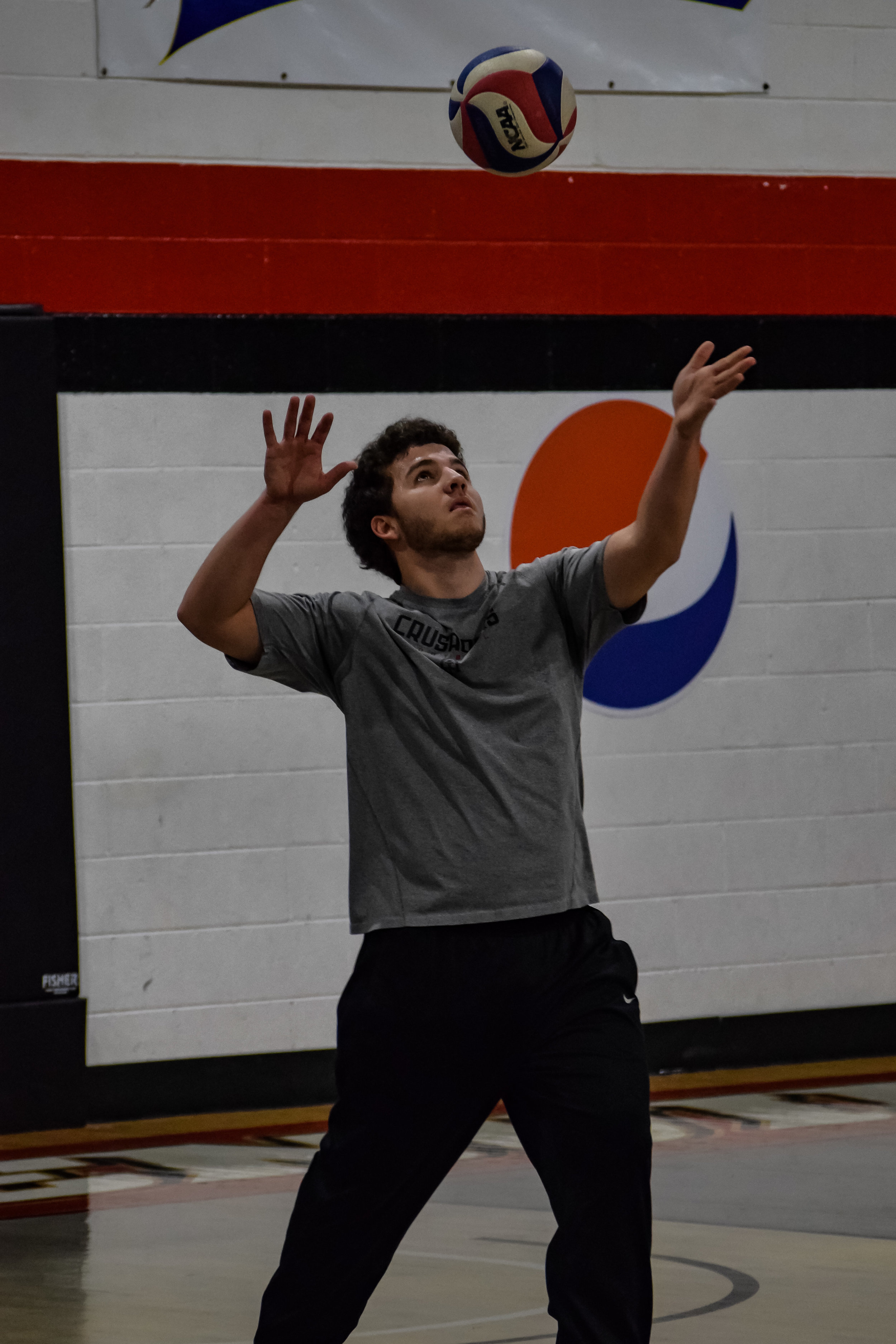 Caleb Harvell gets ready to serve the ball.