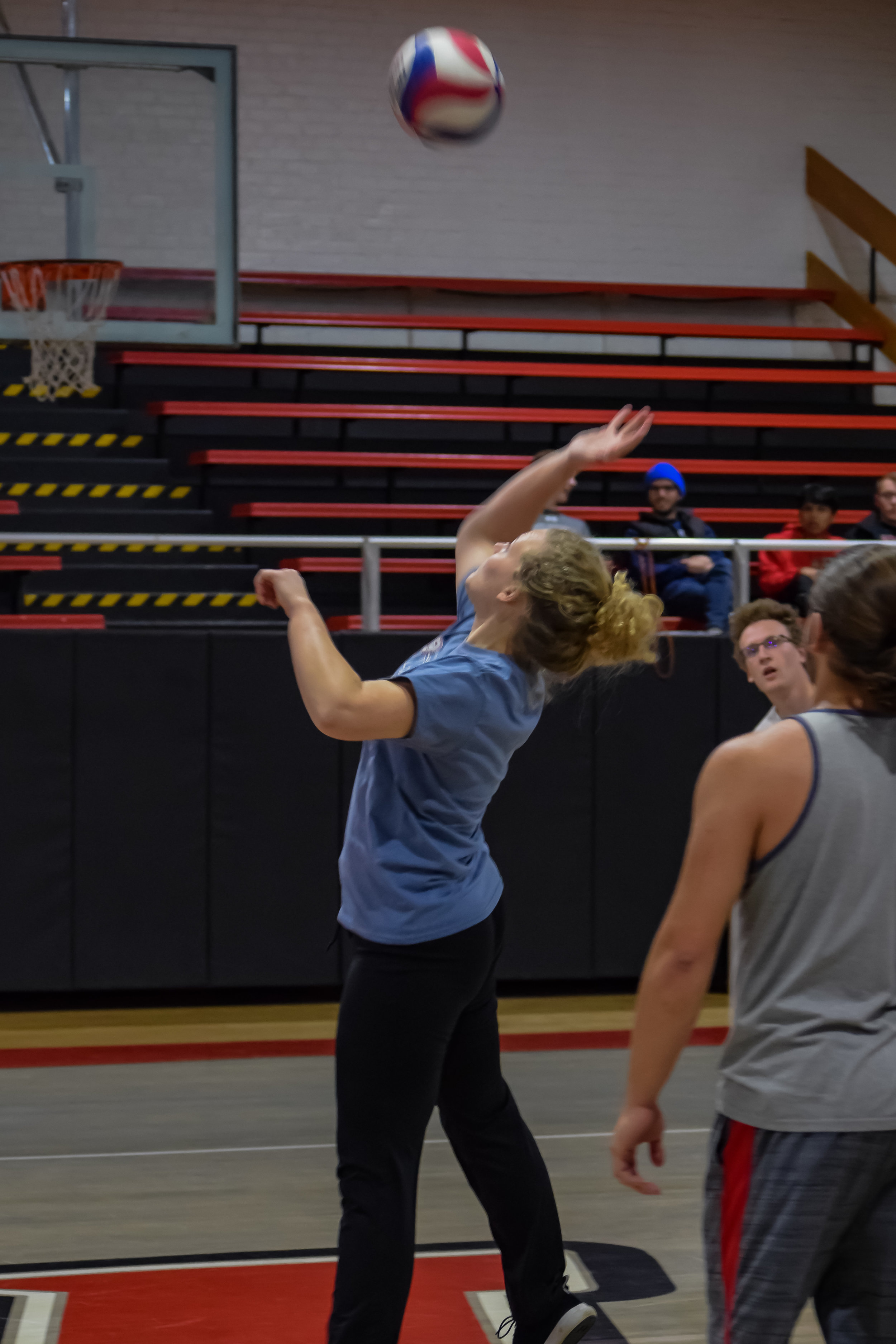 Hannah Reese draws her arm back to hit the ball with a powerful force.