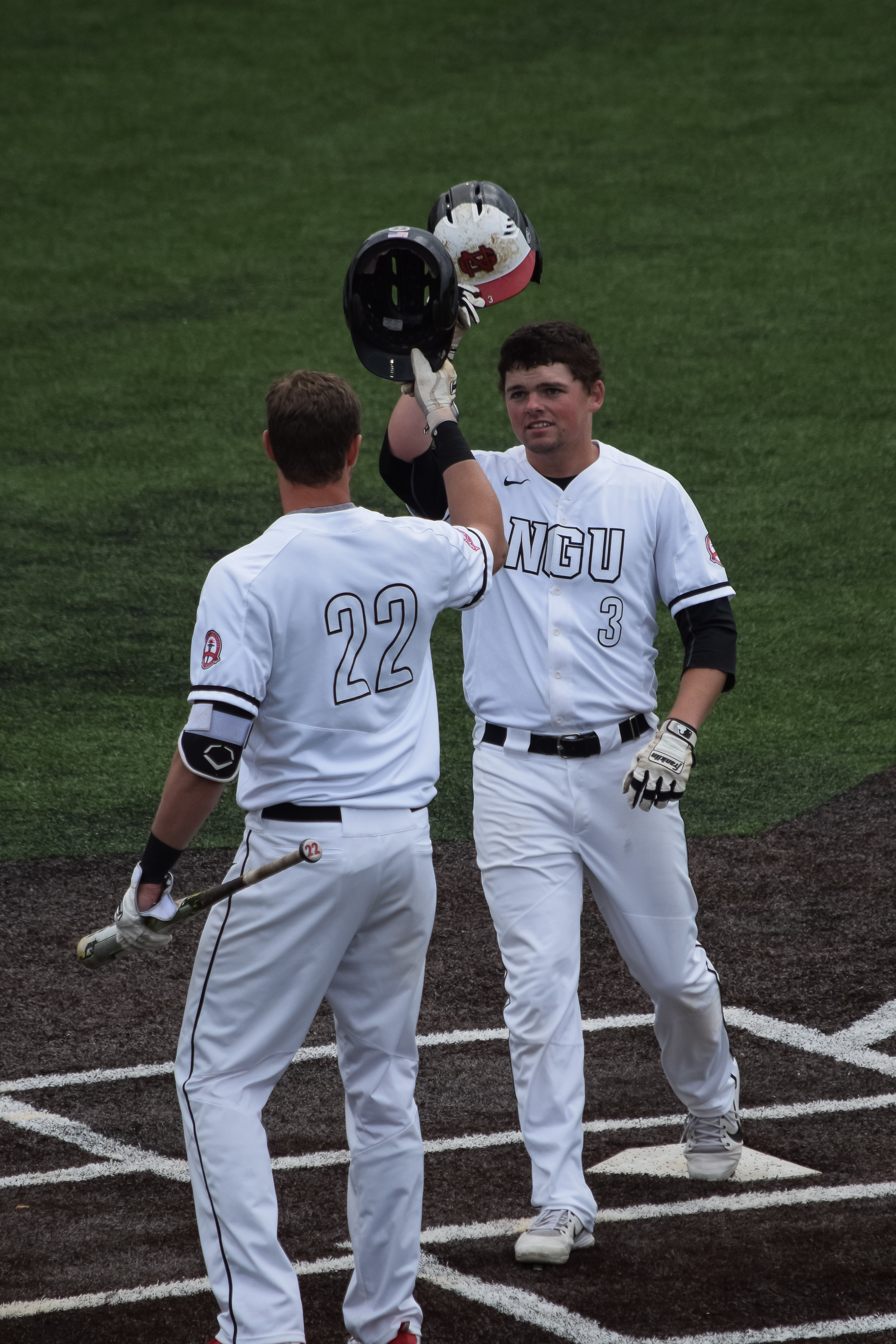 Yes he can. Brown makes his way around the bases to be congratulated by teammate Andrew Plunkett.