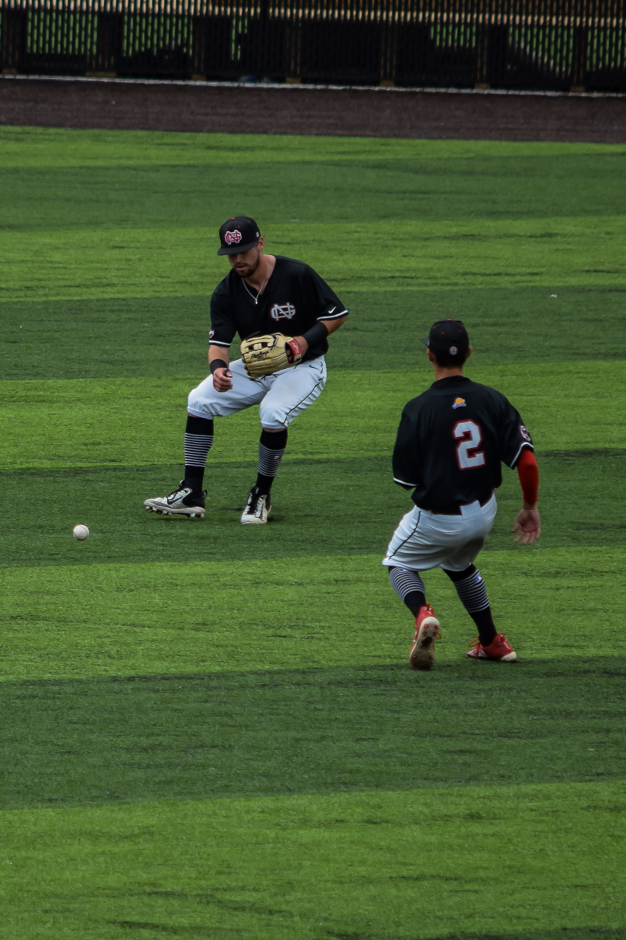 Black and Jones rush to gain control of the ball.&nbsp;