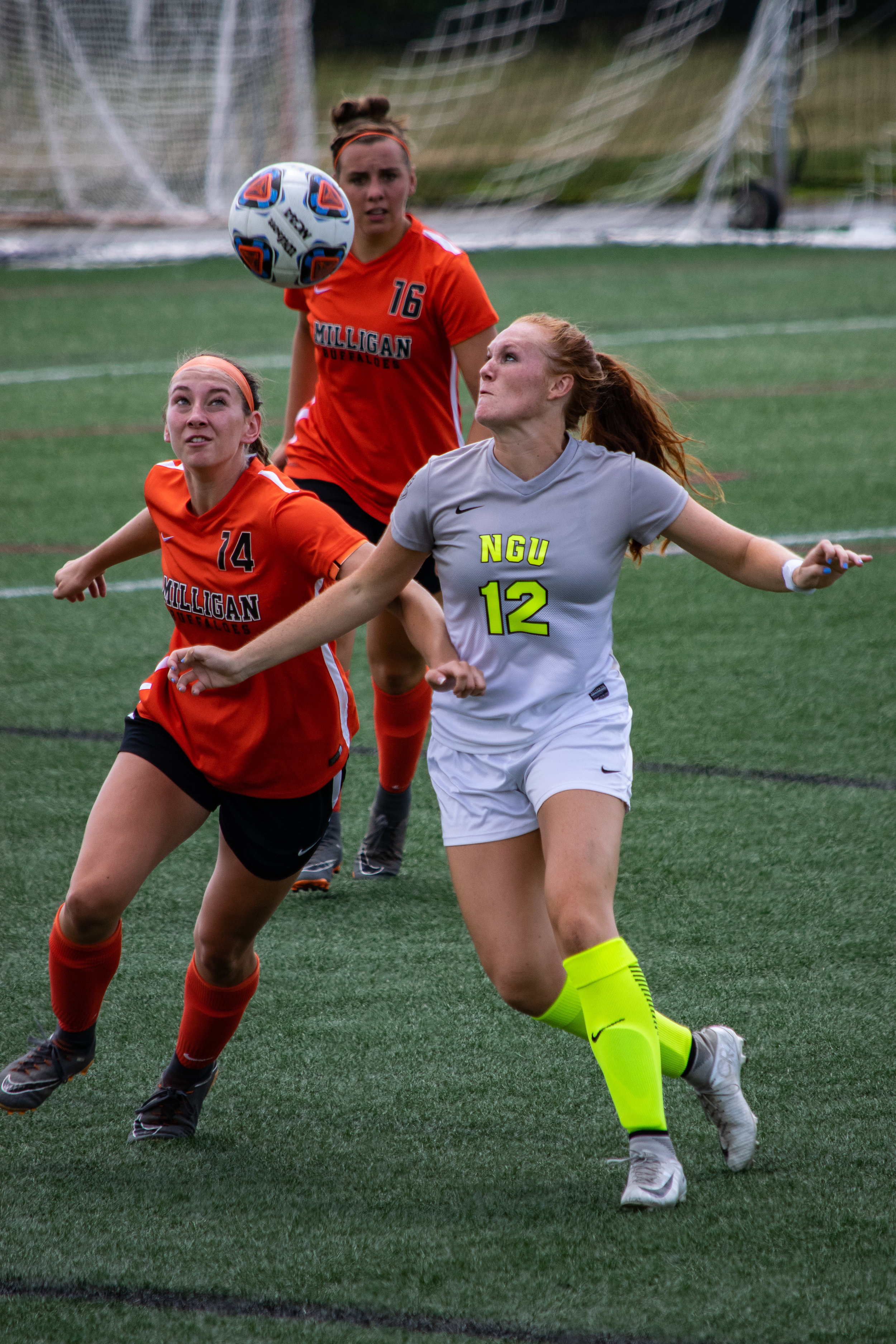 #12 Mary Puryear fights for possession for the ball.