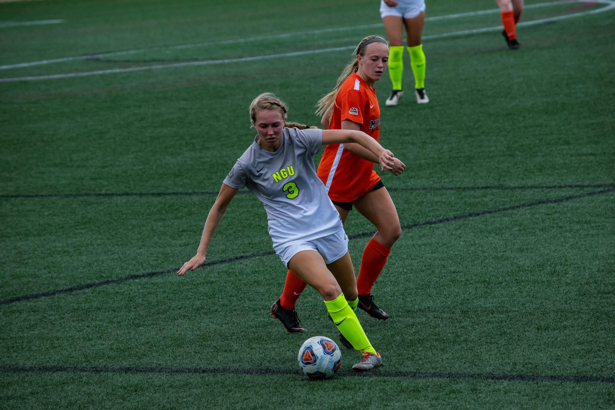 #3 Ariana Perry pivots as she begins to direct the ball to the opposite end of the field.