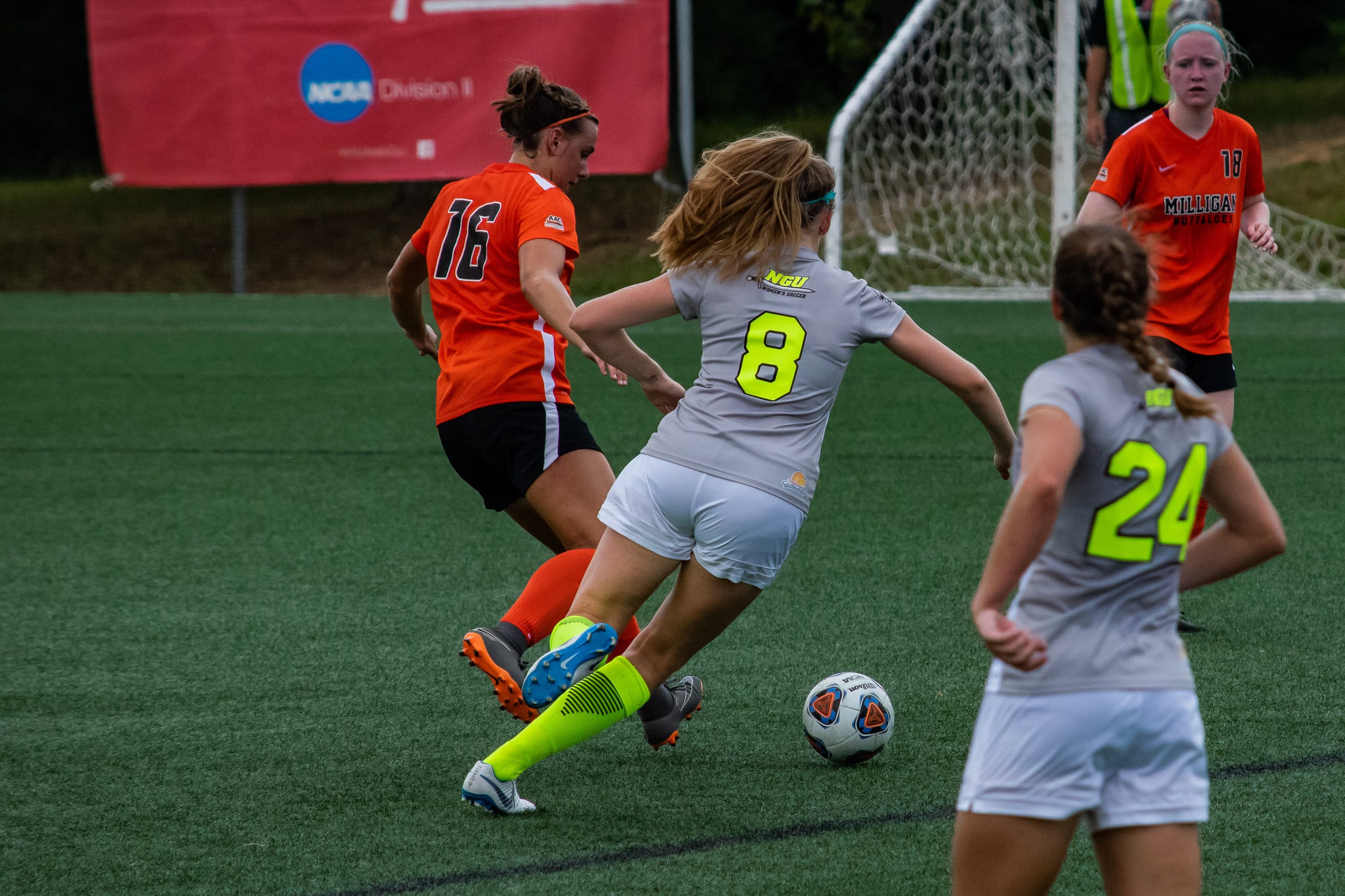 #8 Shelby Shepard rushes to kick the ball before the opposing team can kick it.