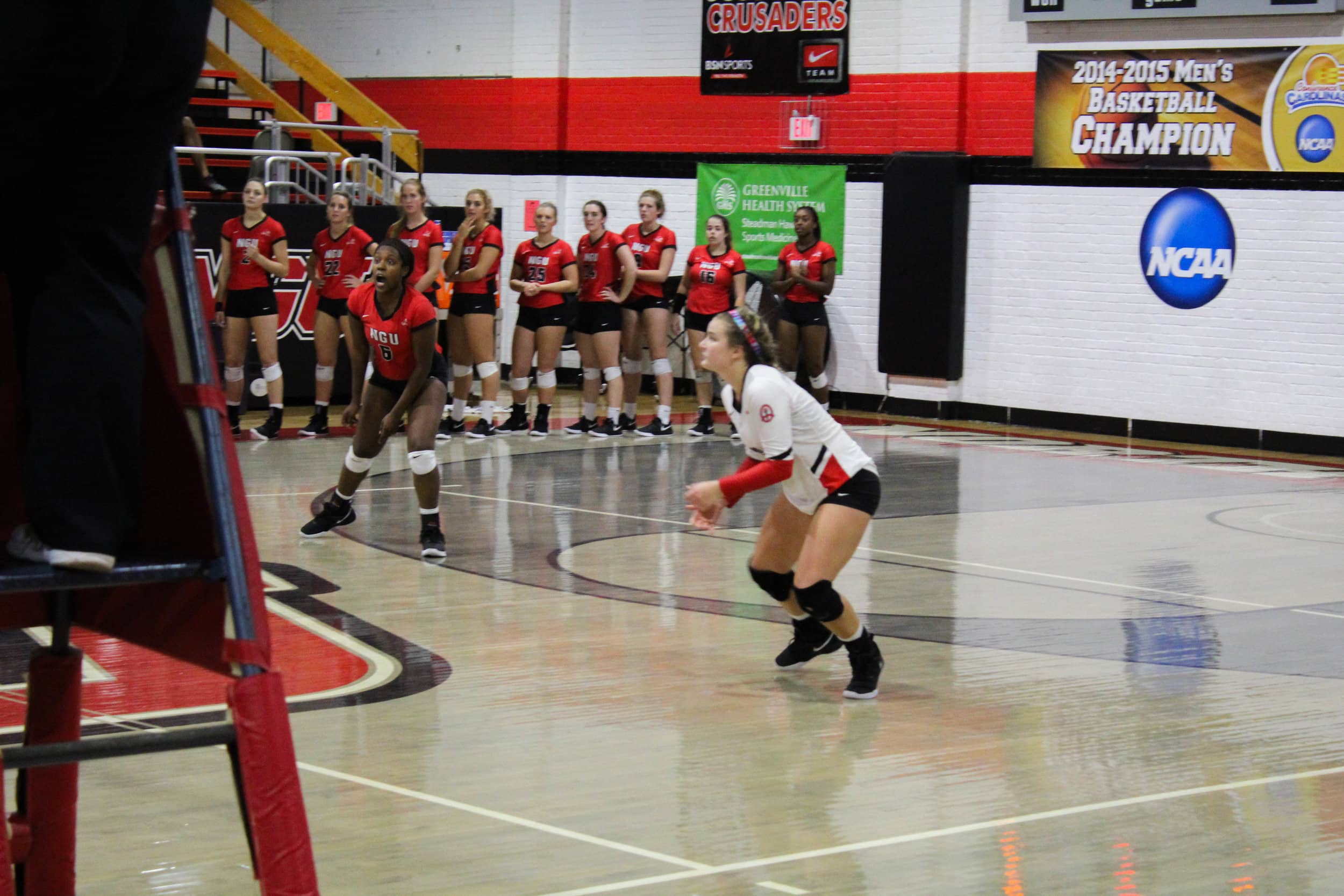 Freshman, Whitley Kahler (10) squats to get ready for the ball approaching her.