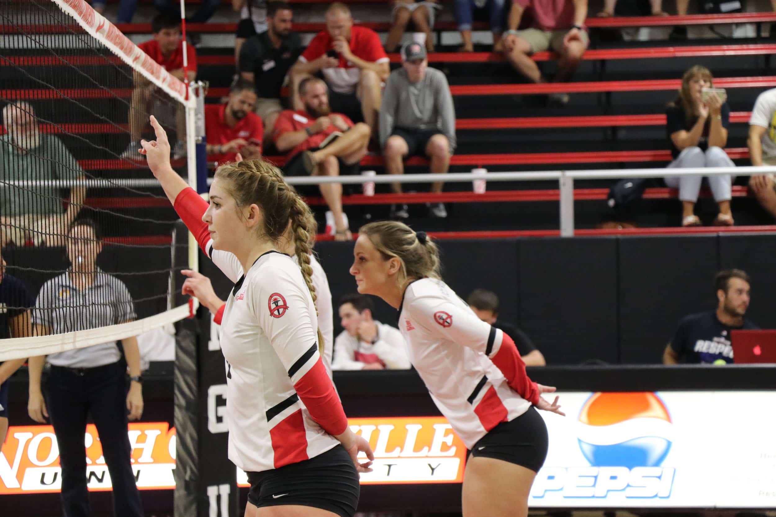 Sophomore, Rachel Miller (8) prepares to spike a ball.