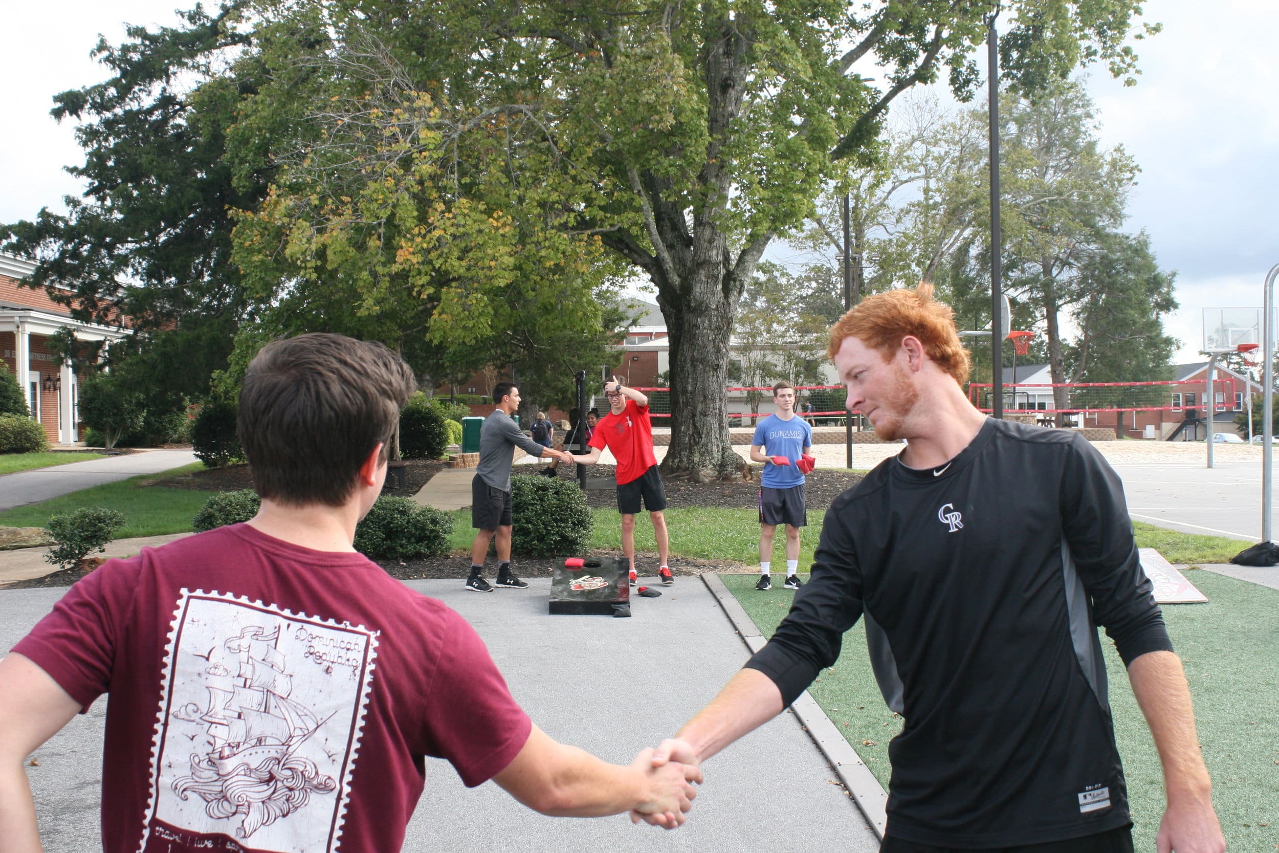 The two teams shake hands respectively after Criminal Justice takes the win.