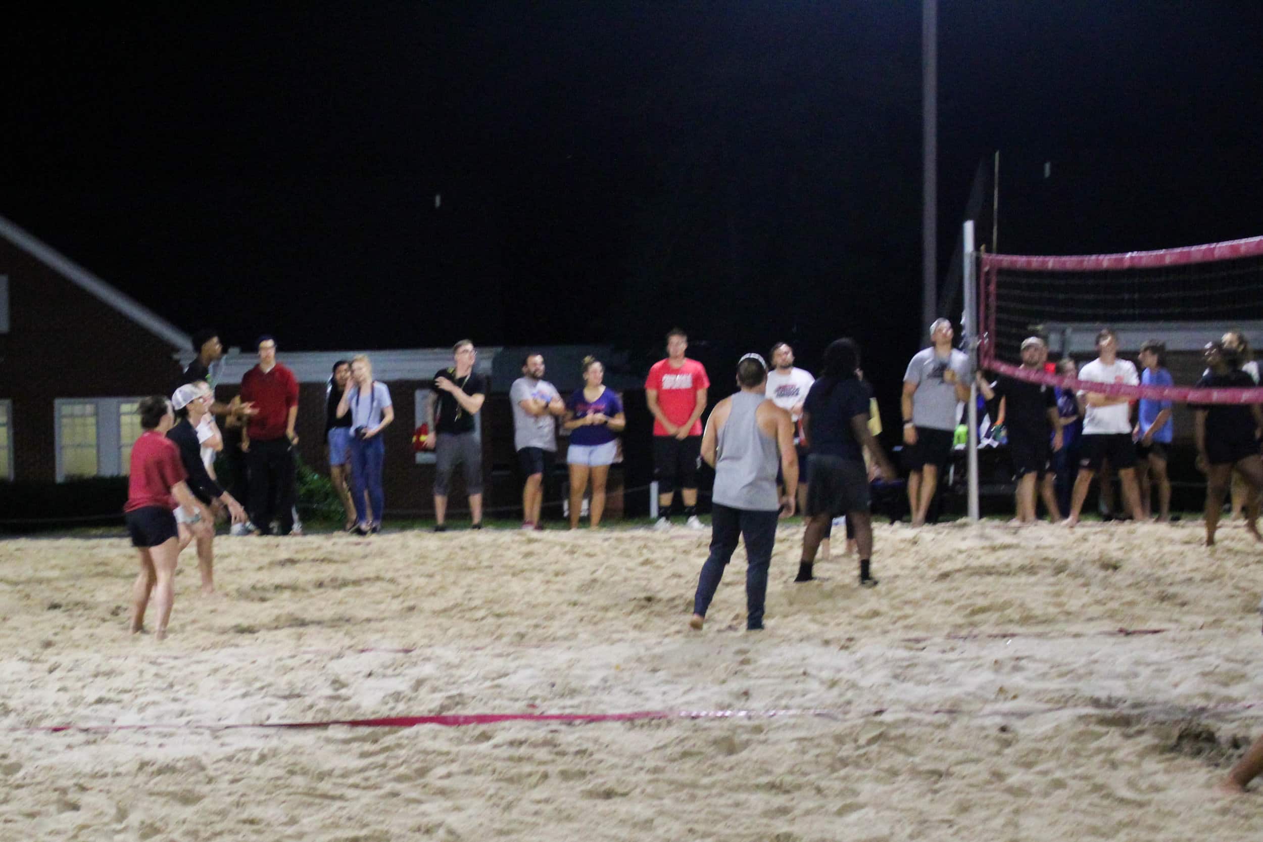 Students stand and cheer on their clubs as they play.