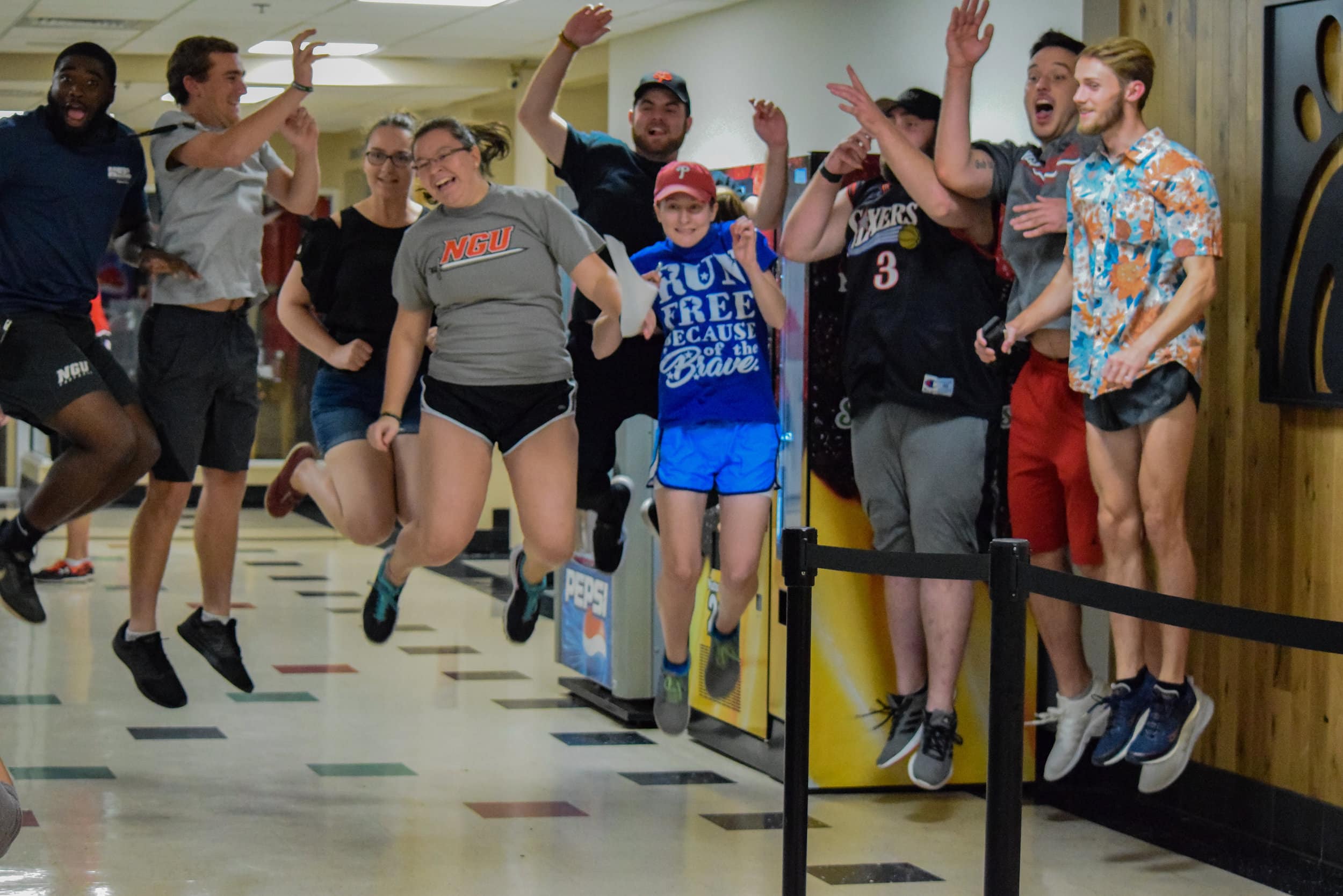 The criminal justice club jumps for joy as they get ready to set off on the race.