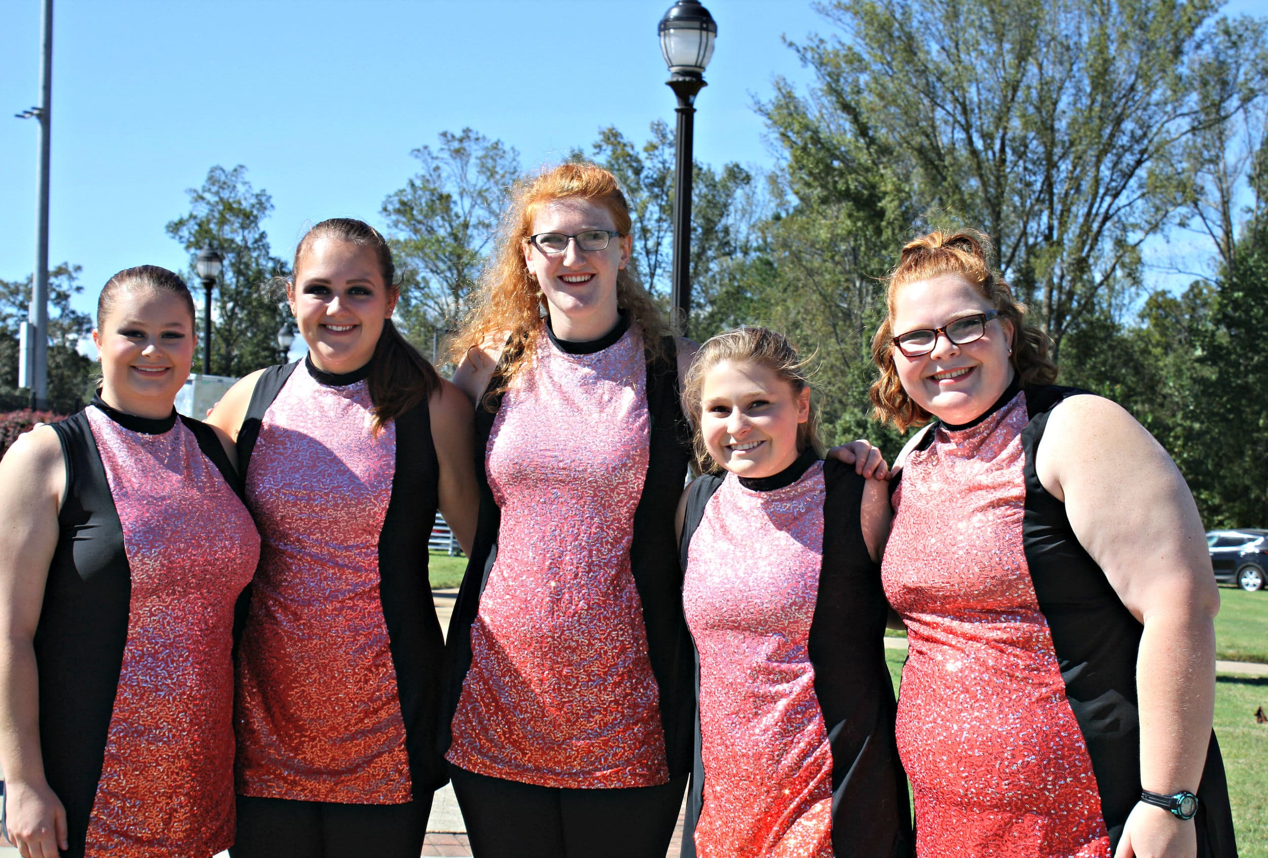 The girls are all smiles after their dazzling performance in the parade.