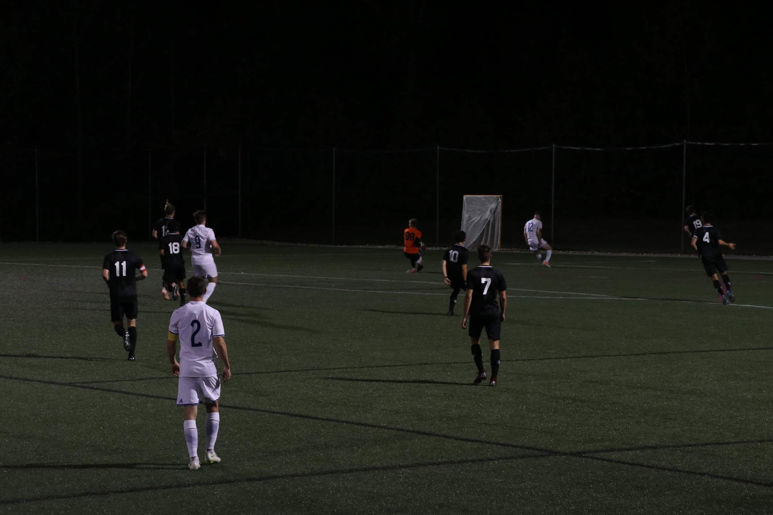 Goal keeper (88) sophomore, Noah Kendrick blocks the ball from going into the goal.