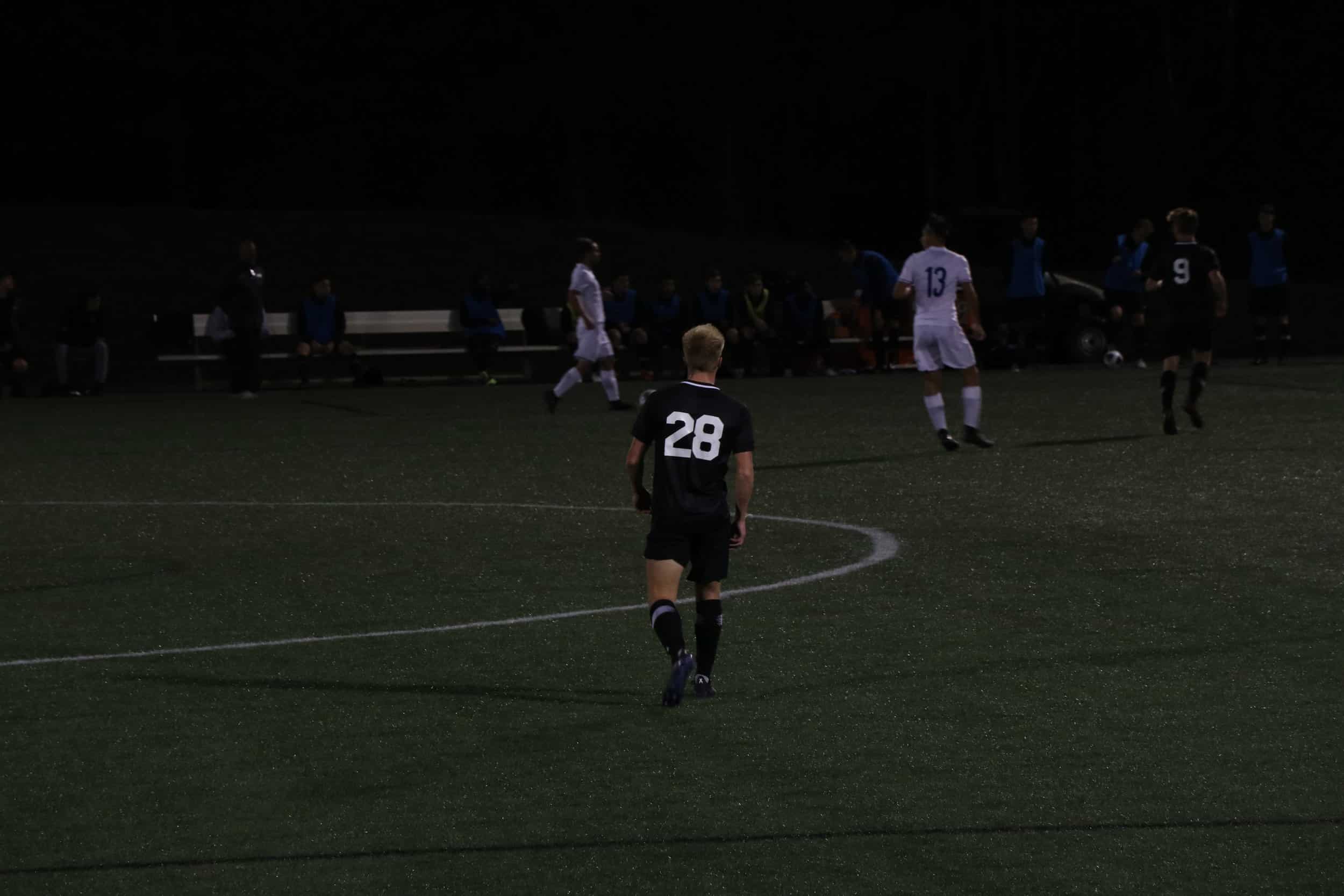 Freshmen, Zach Baker (28) starts to get ready for the ball to come his way.