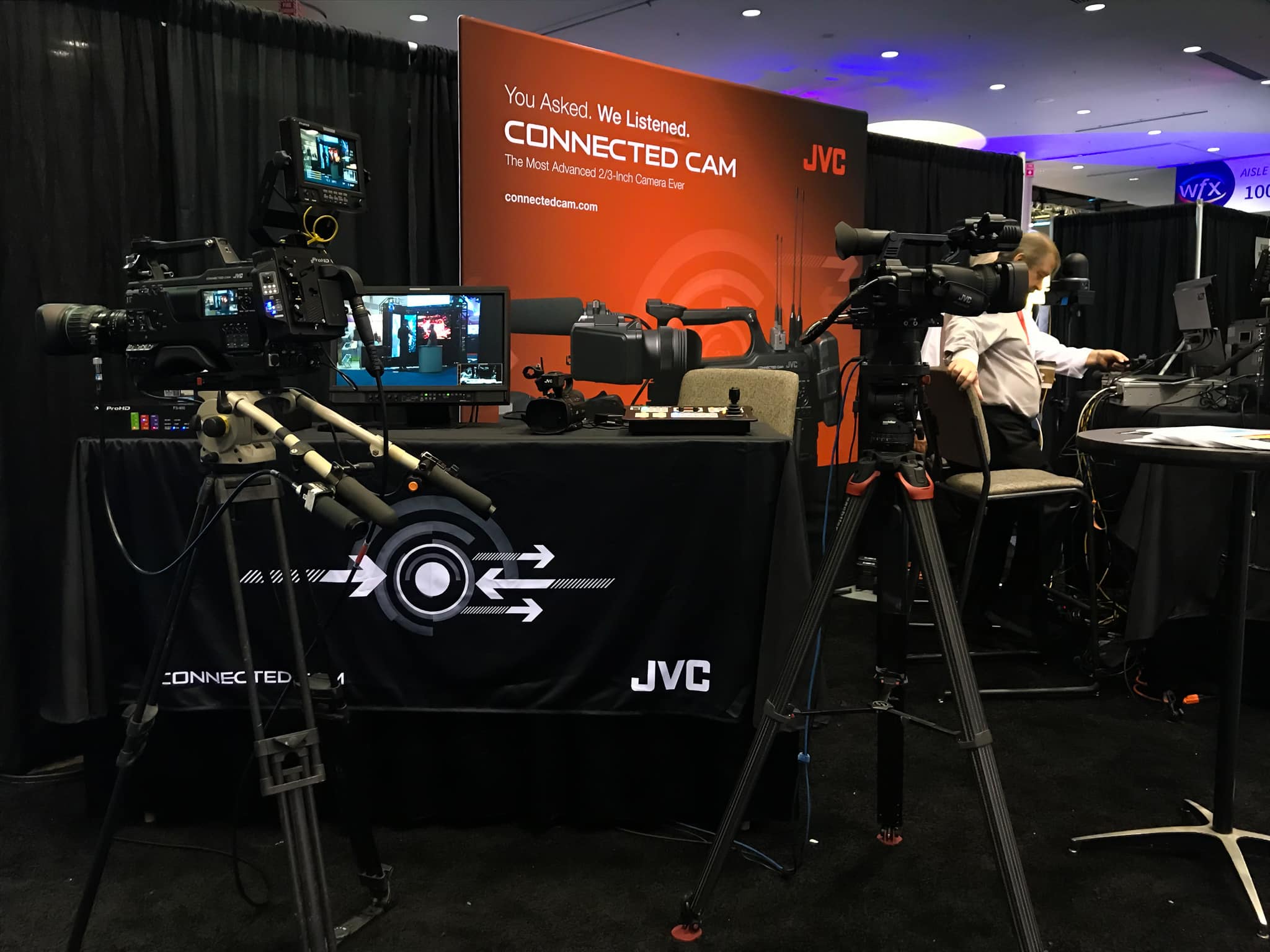 JVC is a company that sells different types of media equipment. Here they displayed some of their newest cameras to entice video team members.