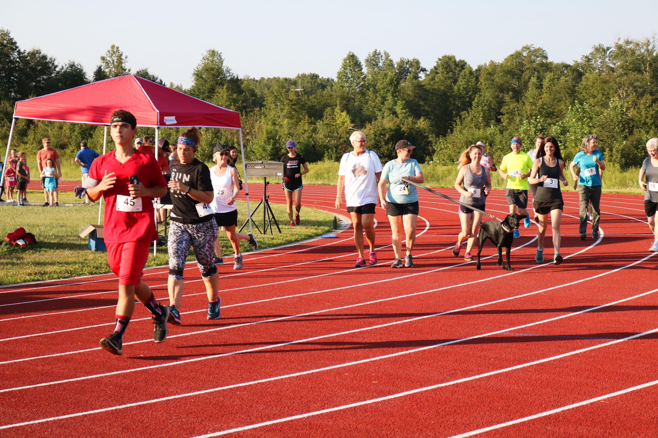 The participants in the 5k start their race around campus early Saturday morning.