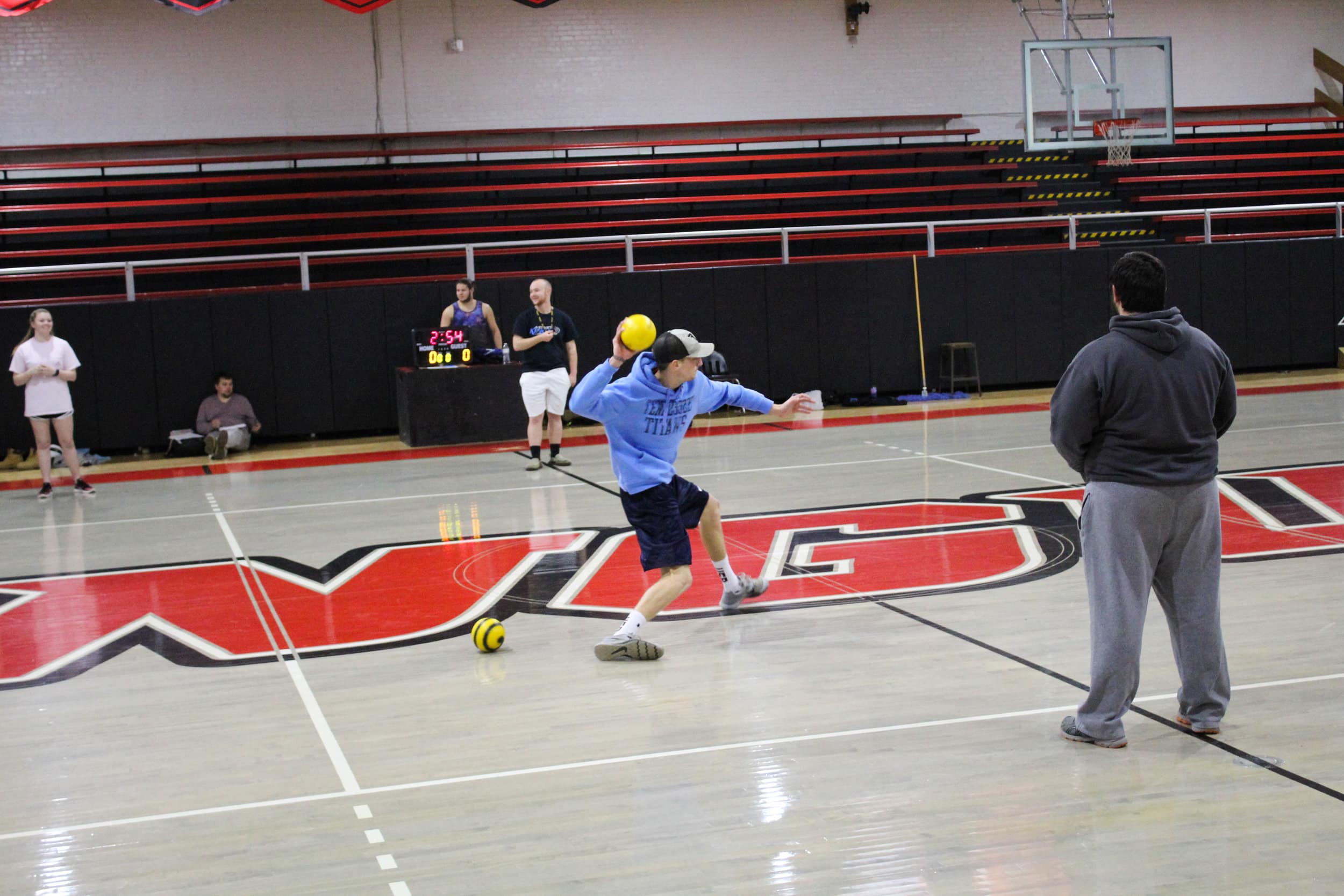 Junior Adam Daniel charges towards the line as he throws the ball at the other team.