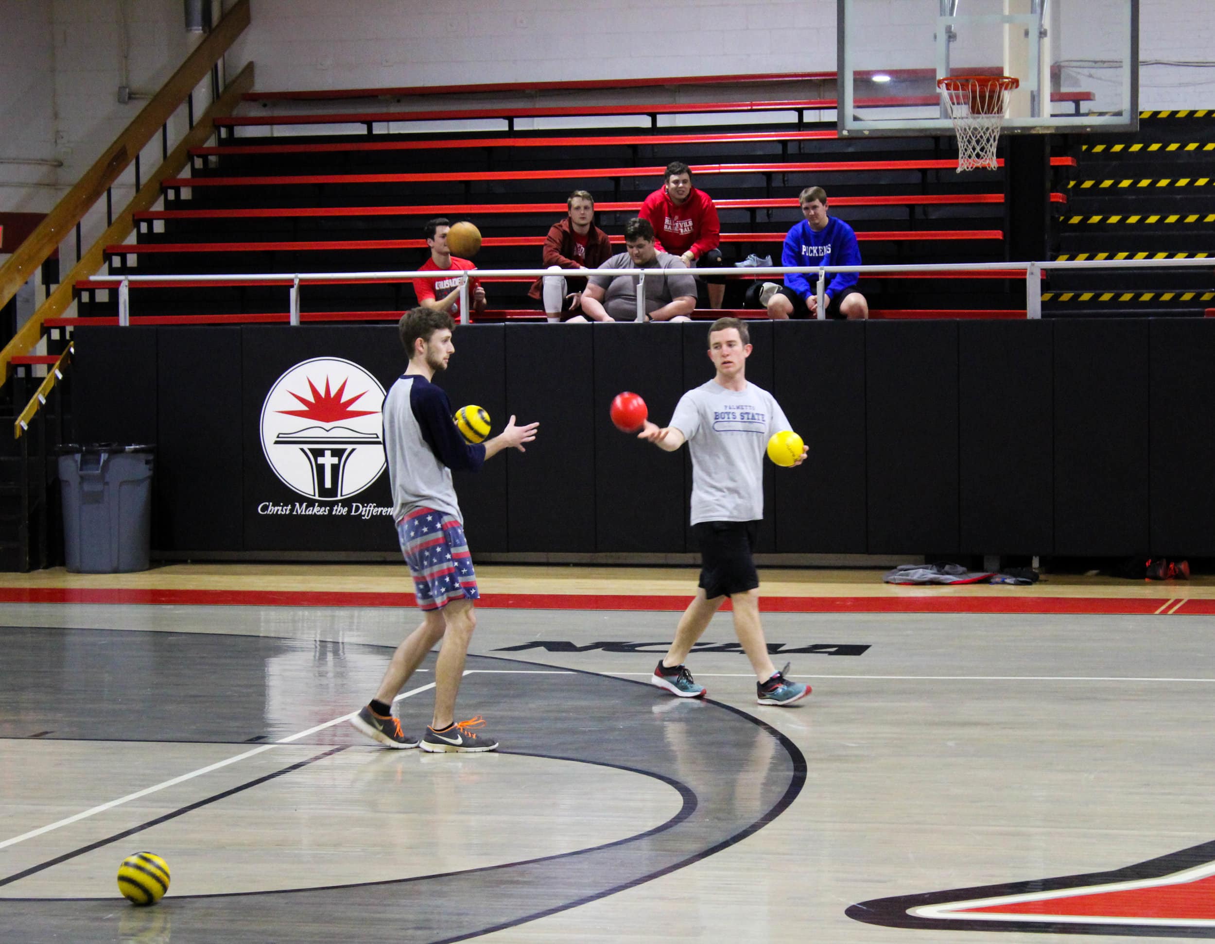 Freshman James Shelley tosses the ball to his teammate while they head towards the middle line.