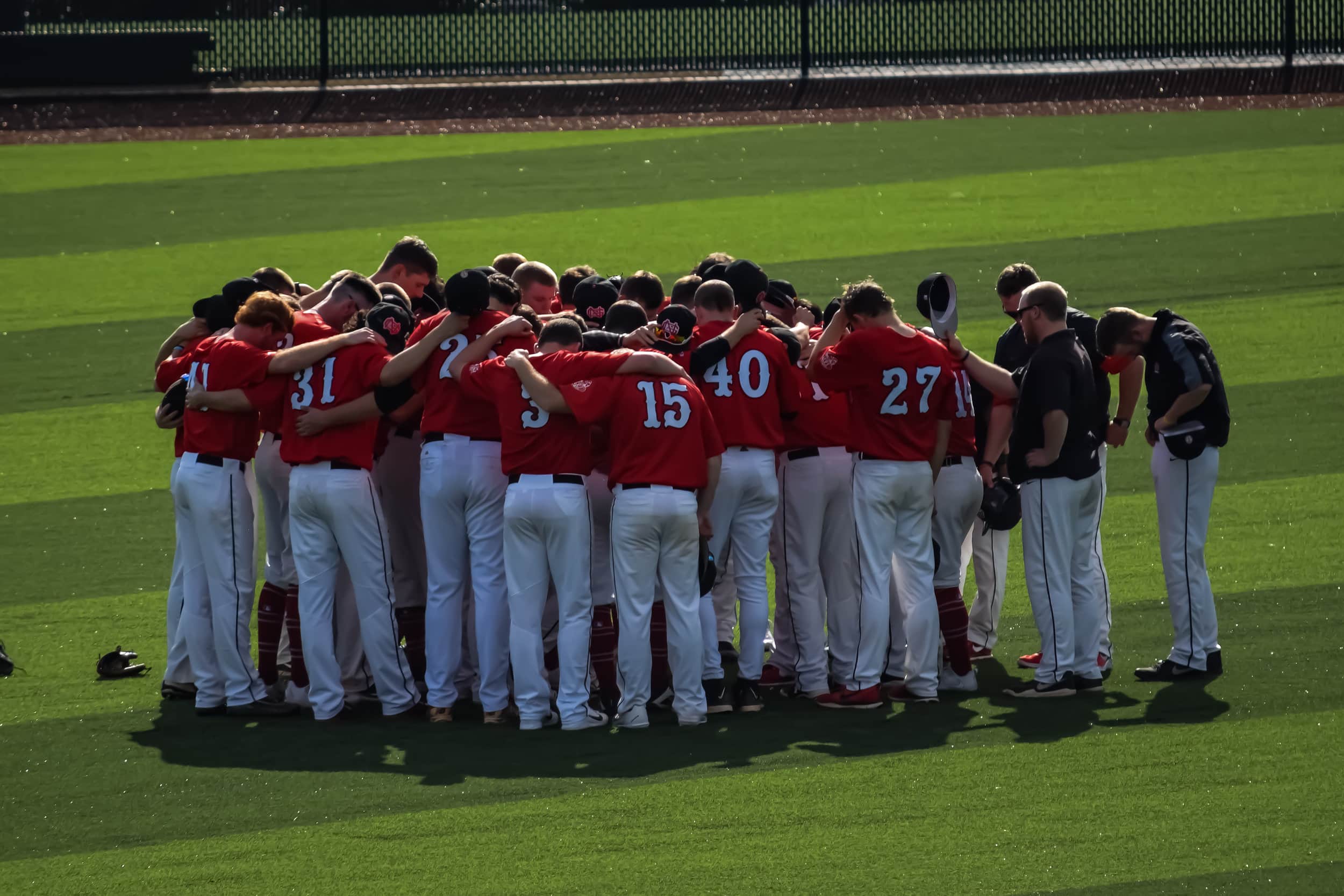 NGU prepares for the game the right way, by praying together as a family.