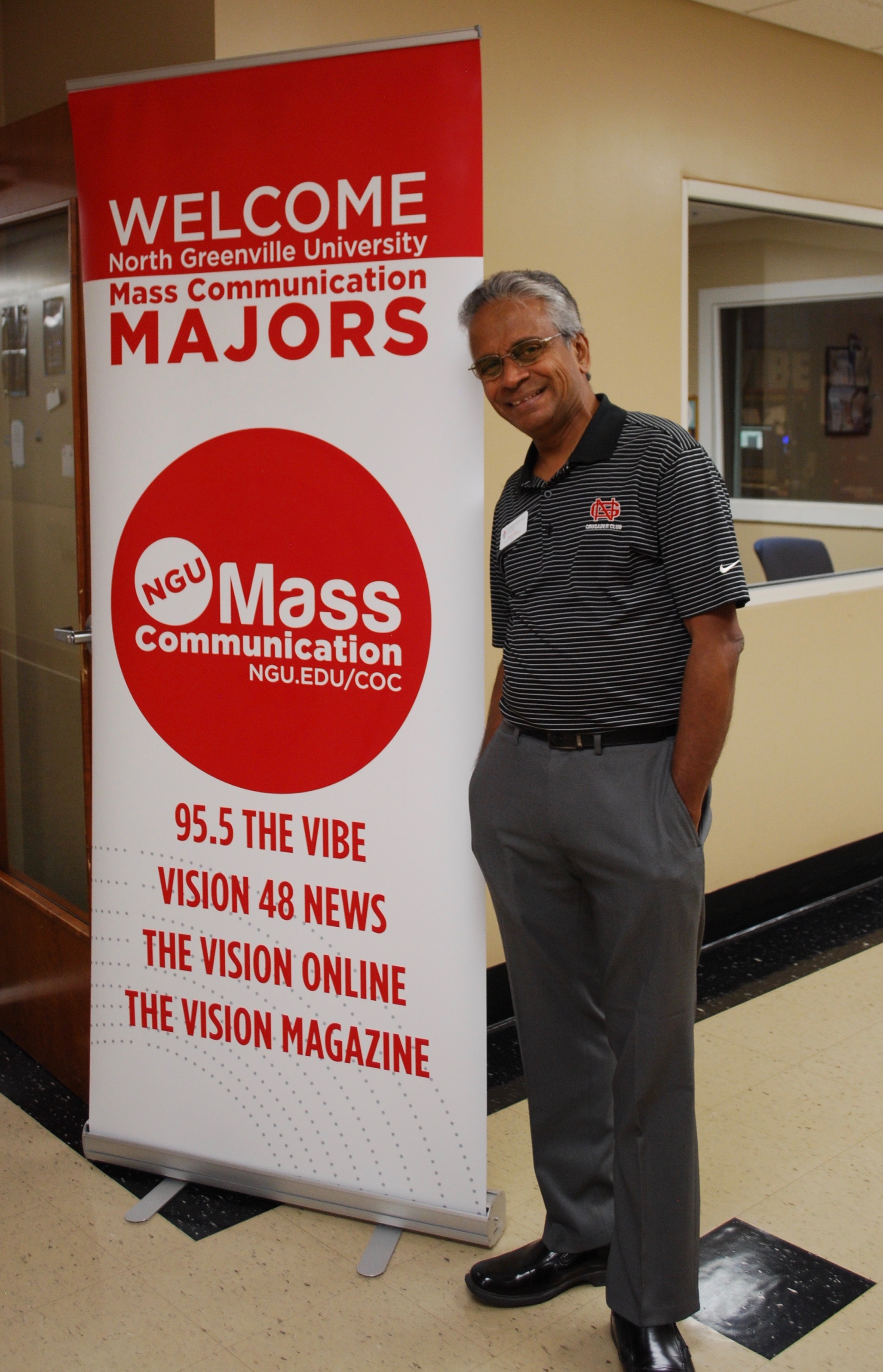 Mass communication professor Shur Gopal waits to greet students.