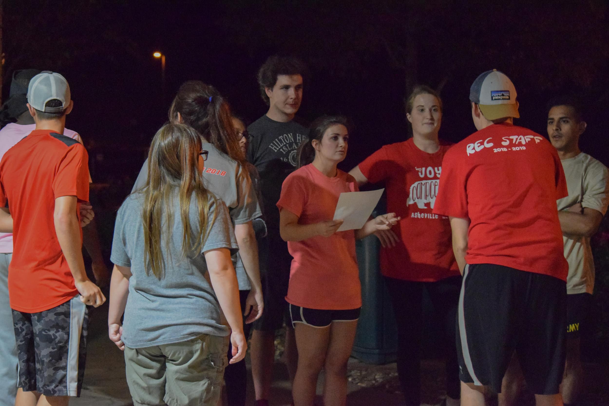 The animal science club listens to their official as he gives a run down of each event.