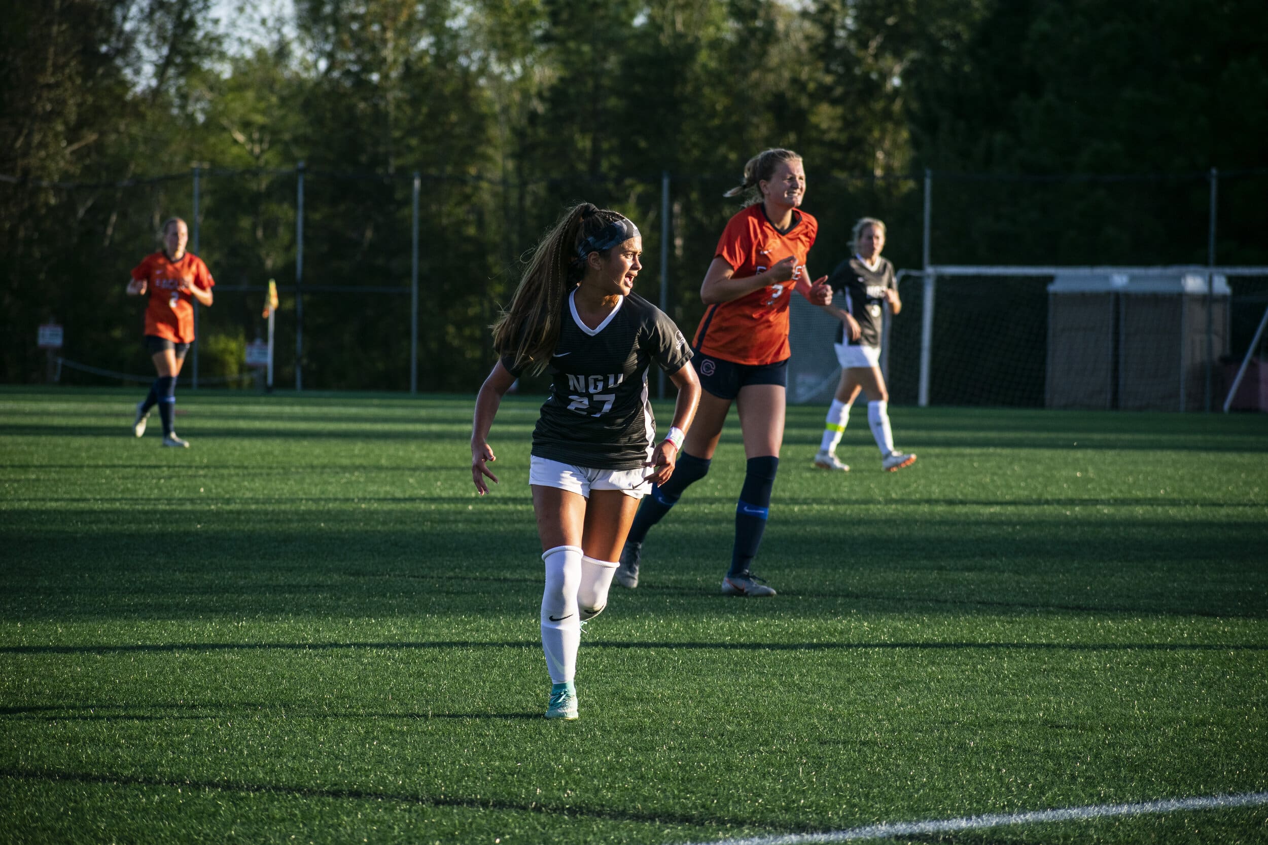 Sophomore Alyssa Mendez (27) focuses on the ball.