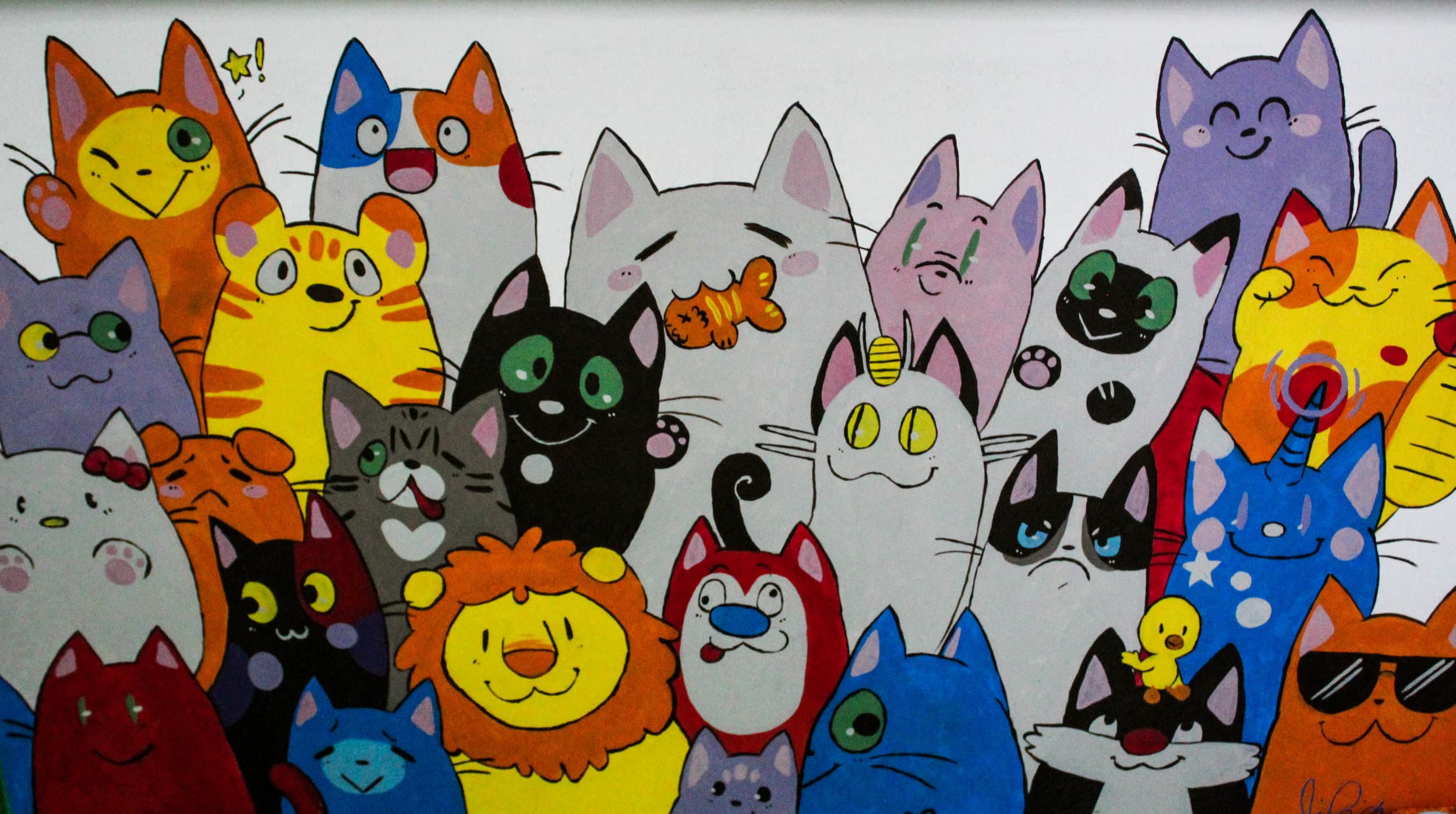 Along the walls of the Organic Cat Cafe are hand painted cats.