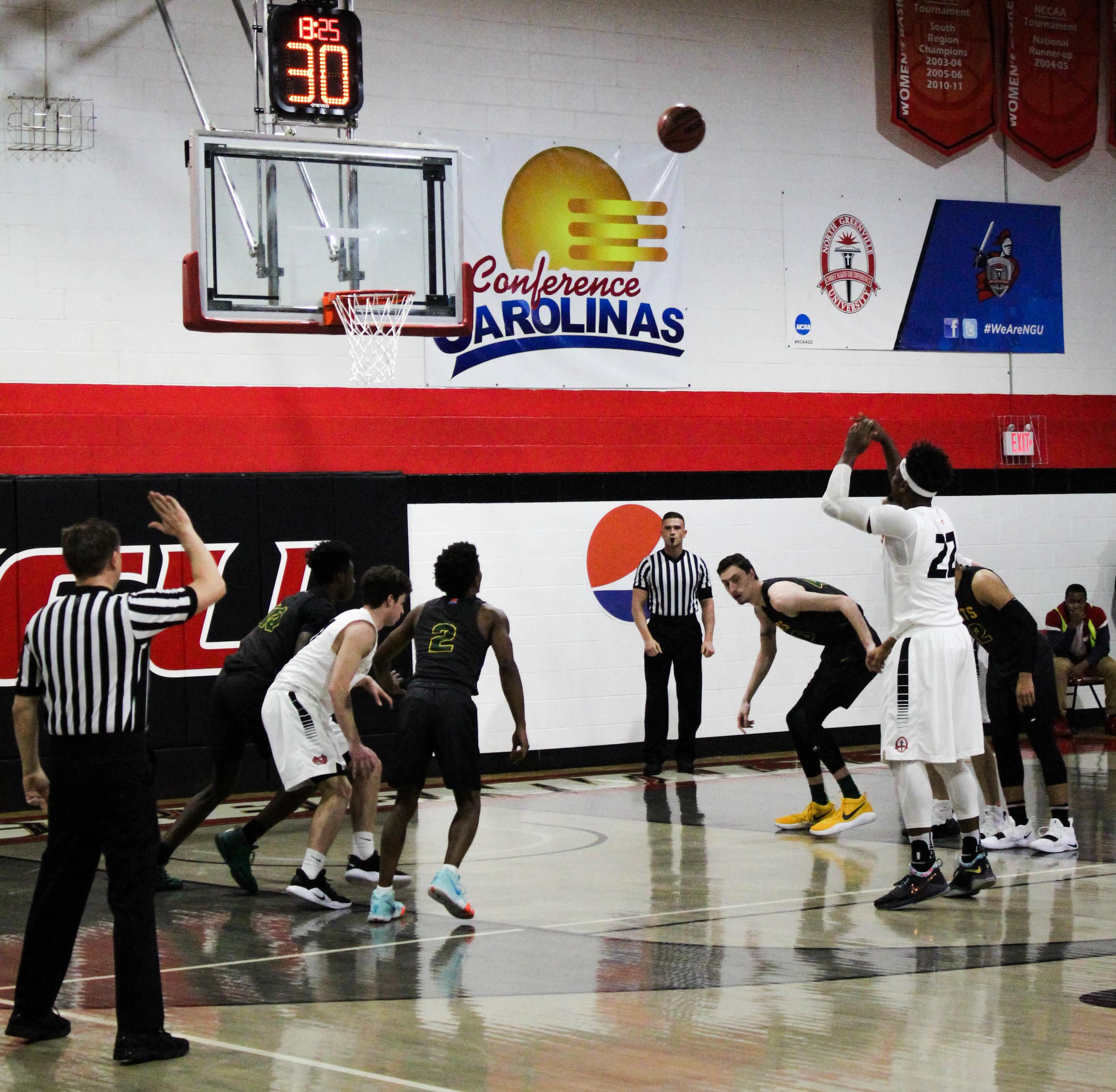 After being fouled while shooting, Roderick Howell (22), a senior at NGU, shoots and makes a foul shot.