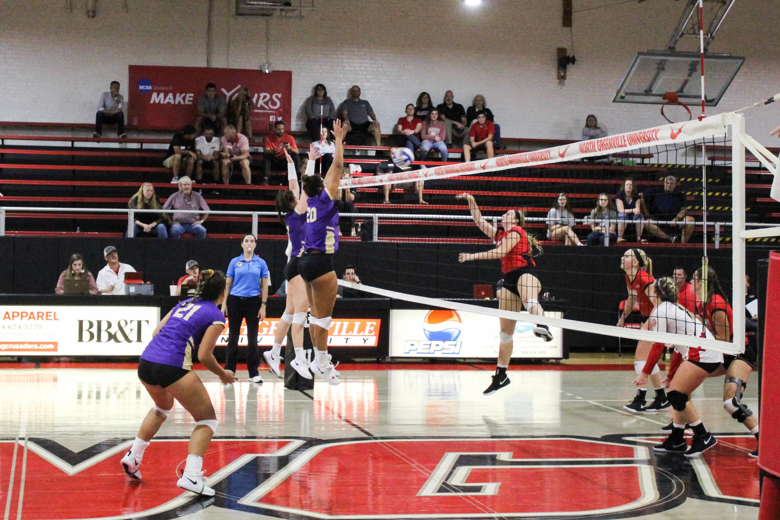 Catherine Lant (10) hits the ball back over the net after a player from Converse hit the ball toward her.