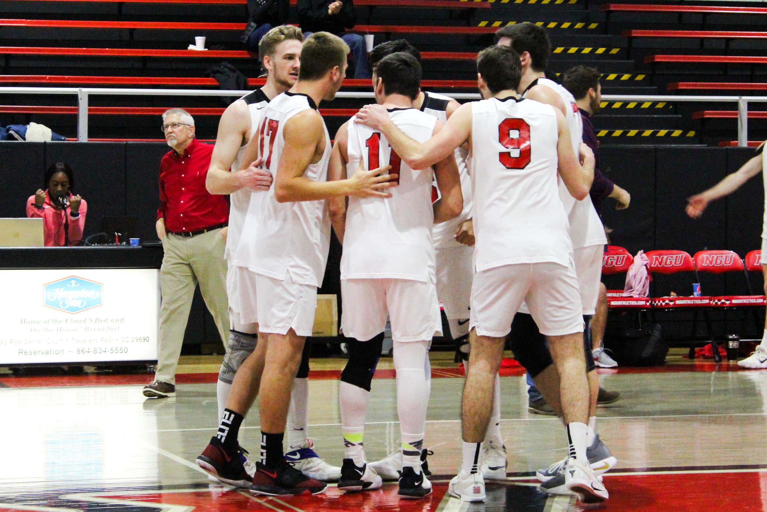 The NGU players congratulate one another after getting a point.
