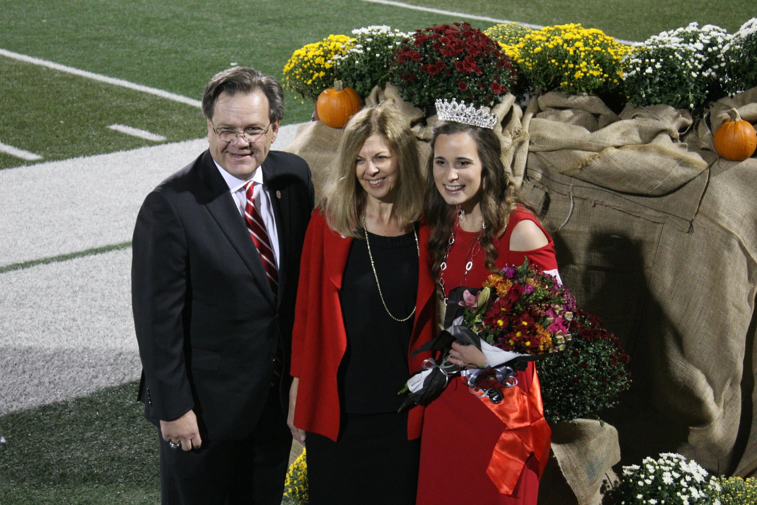 After being crowned NGU Homecoming Queen 2020, senior Lauren Hawthorne is congratulated by President Gene Fant and his wife.