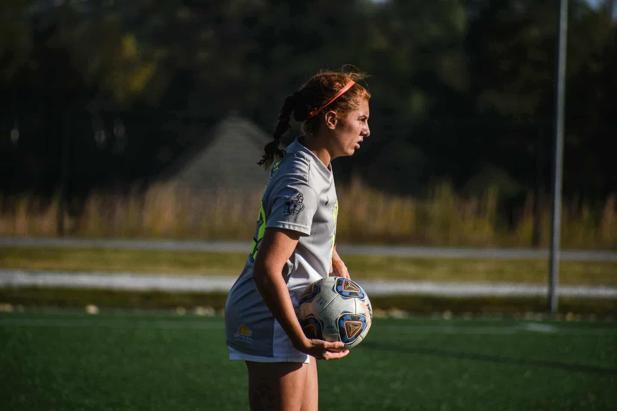 Sophomore Victoria Valentine (22) prepares herself to do a throw in.