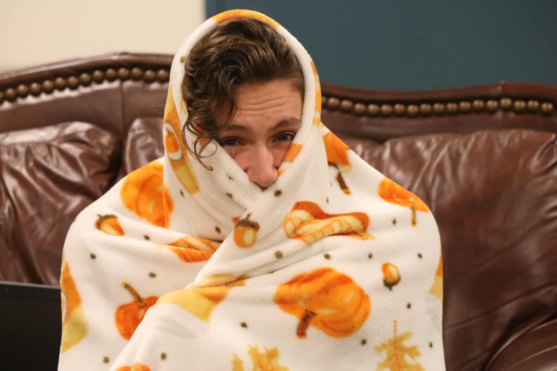 JP Waynick, wrapped in his incredibly soft pumpkin blanket, gives his look of approval. These can be bought at Hamricks.