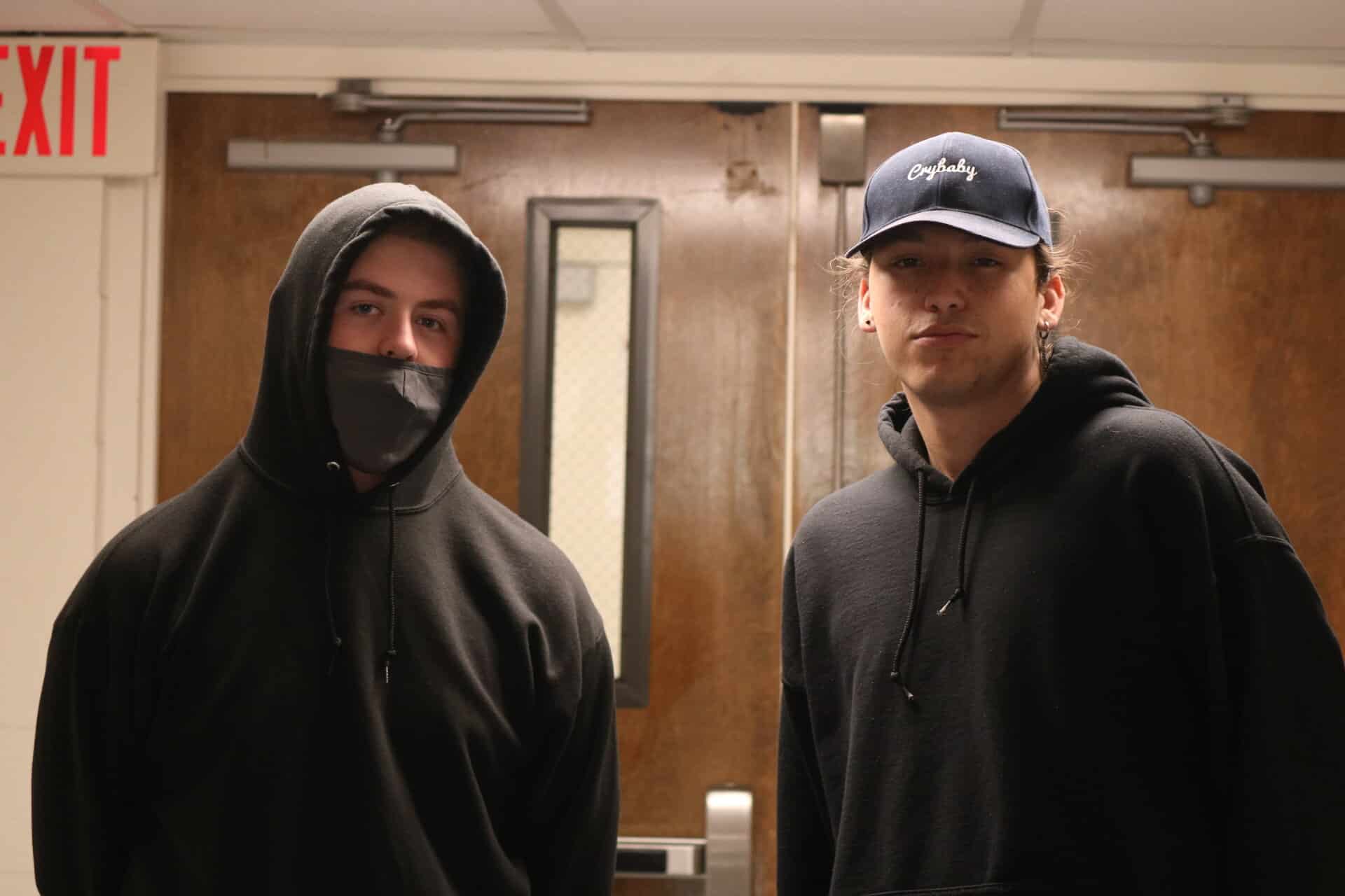Chase Bridges, senior digital media major and Hagen pose in their black hoodies.