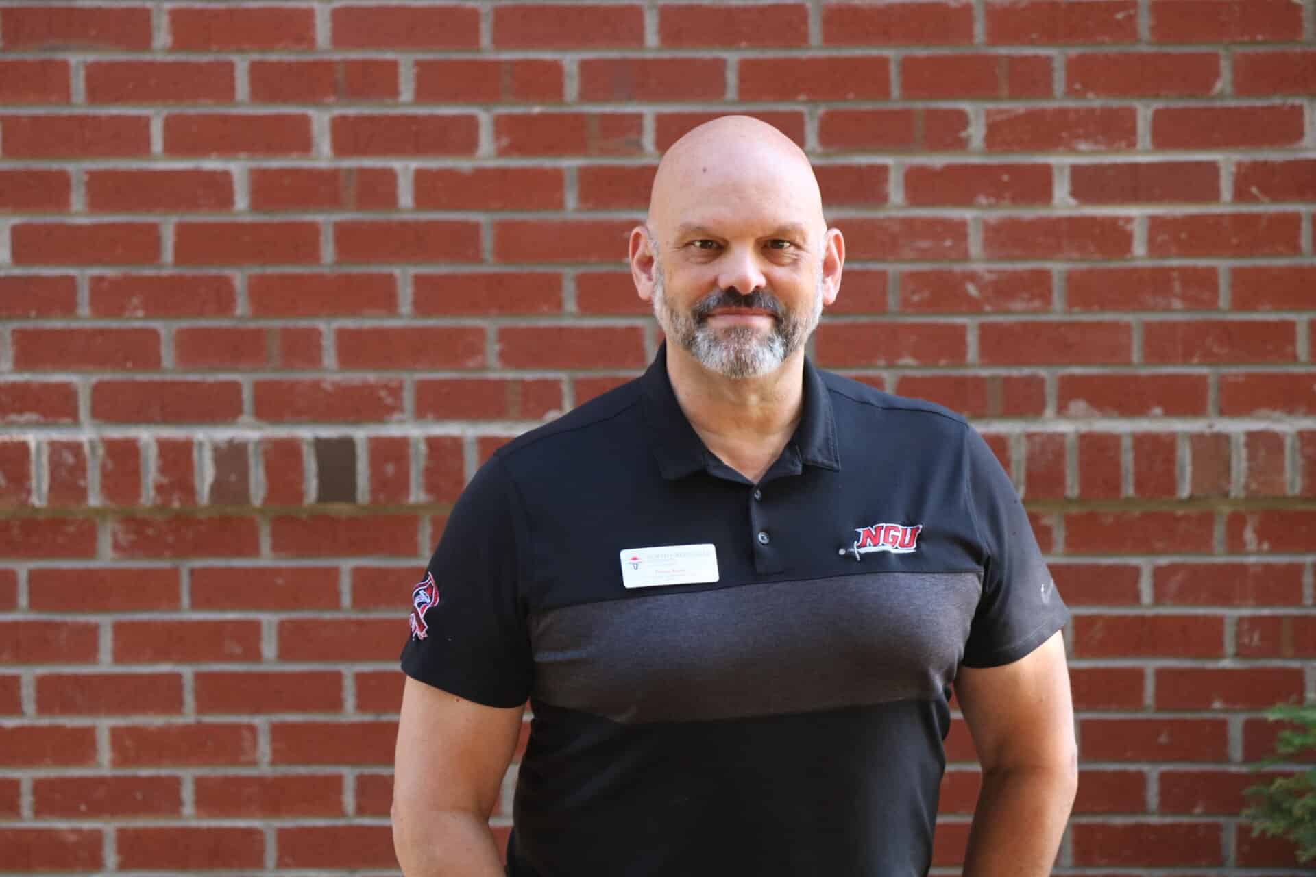 Artus currently heads up NGU’s Printhub producing the school’s signage, printed paper and other print needs. Some know him as the “selfie guy.” Artus is often found snagging a selfie with various people both on and off campus.